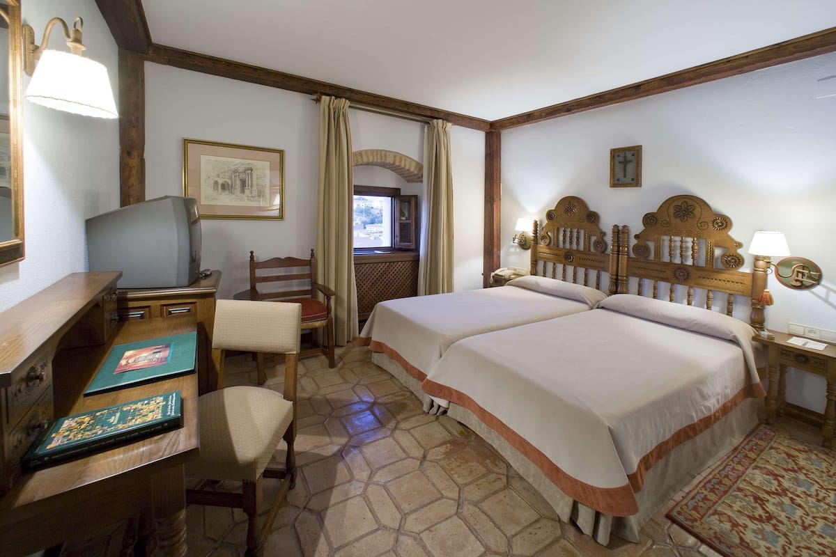 Premium bedding, down comforters, minibar, in-room safe
