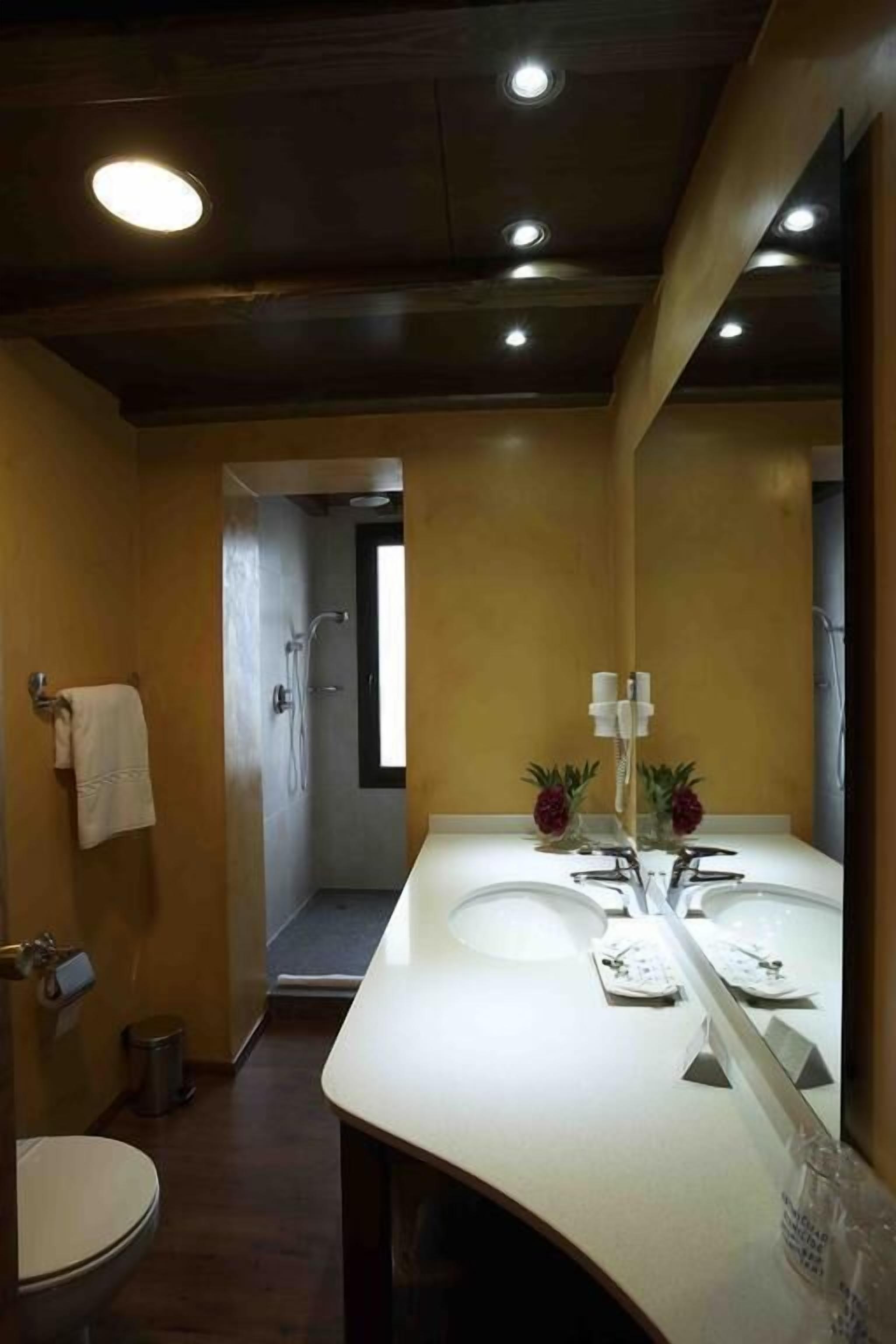 superior triple room | bathroom | shower, free toiletries, hair dryer, towels
