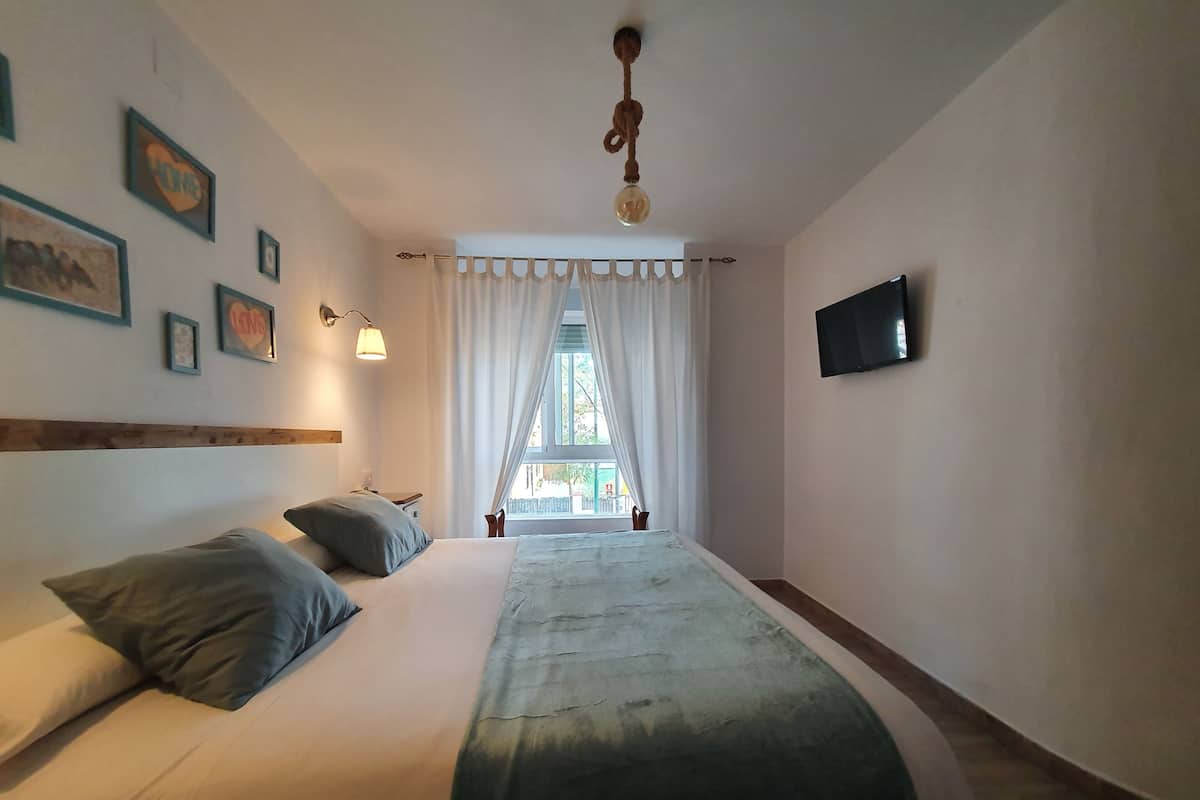 Premium bedding, down comforters, desk, laptop workspace