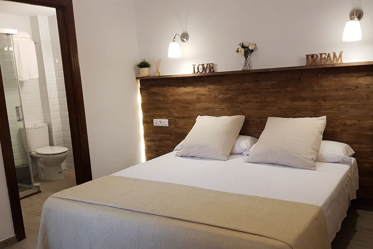 Premium bedding, down comforters, desk, laptop workspace