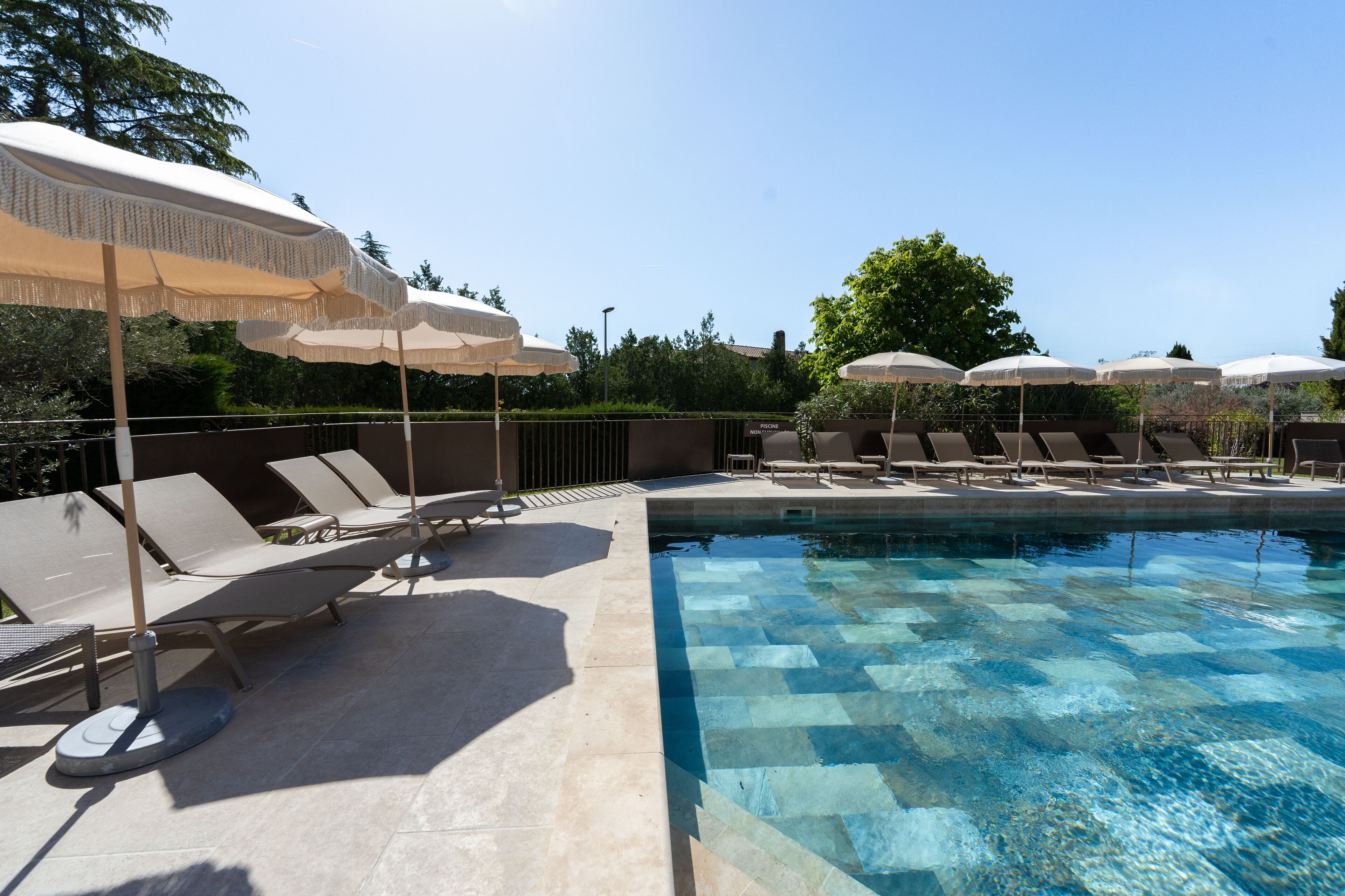 seasonal outdoor pool, pool umbrellas, pool loungers
