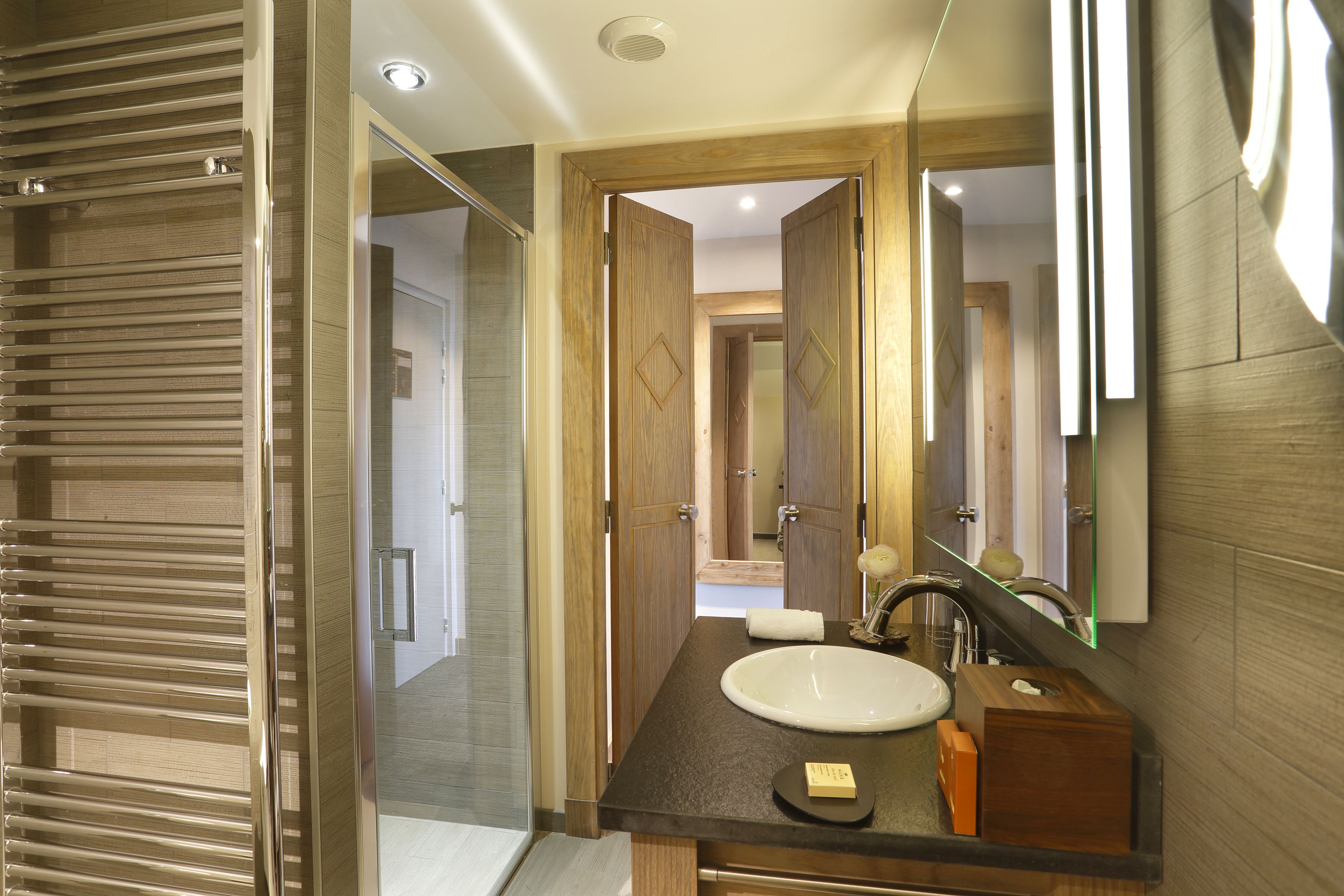 junior suite | bathroom | designer toiletries, hair dryer, bathrobes, slippers