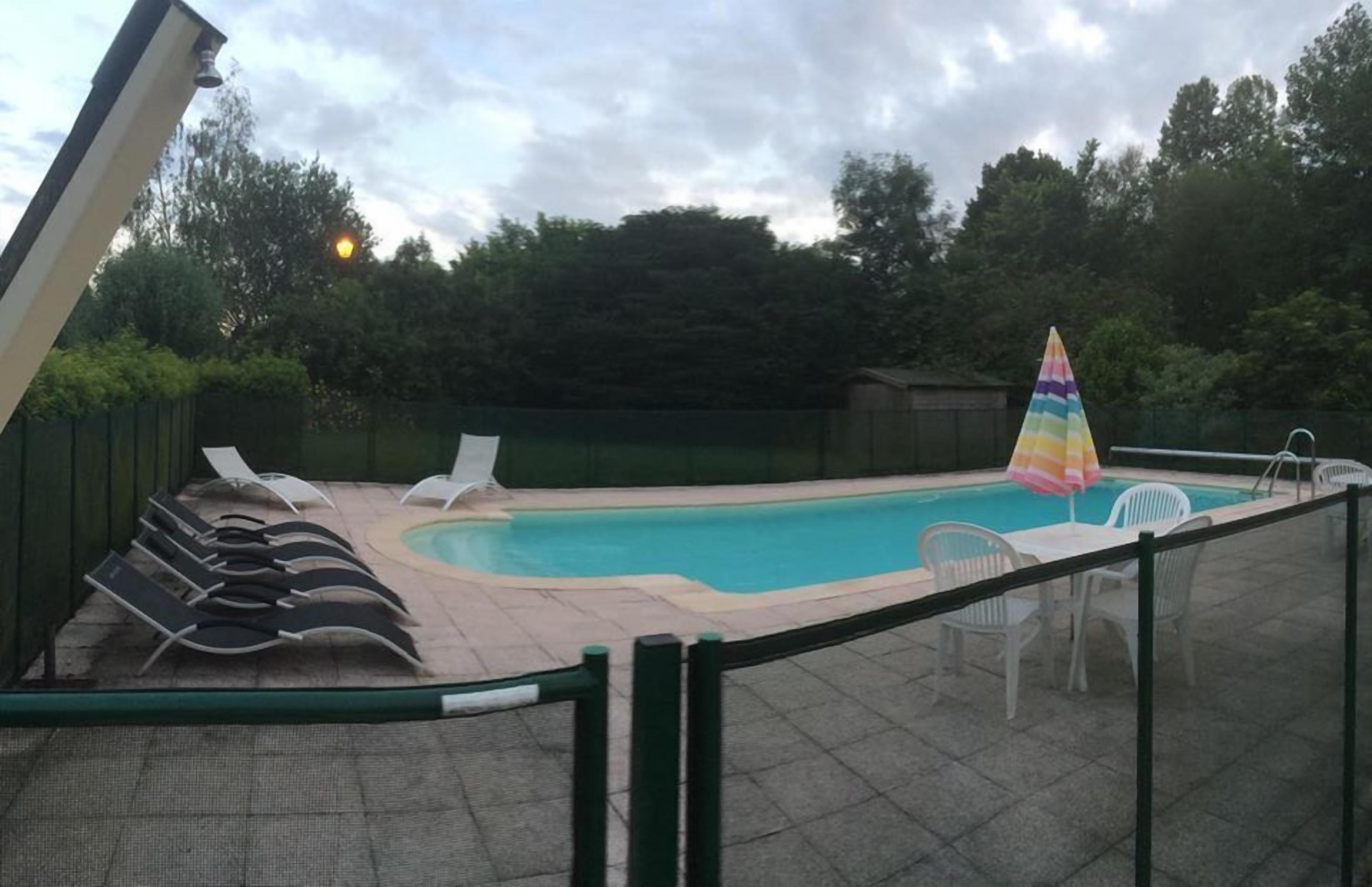 seasonal outdoor pool, pool umbrellas, pool loungers