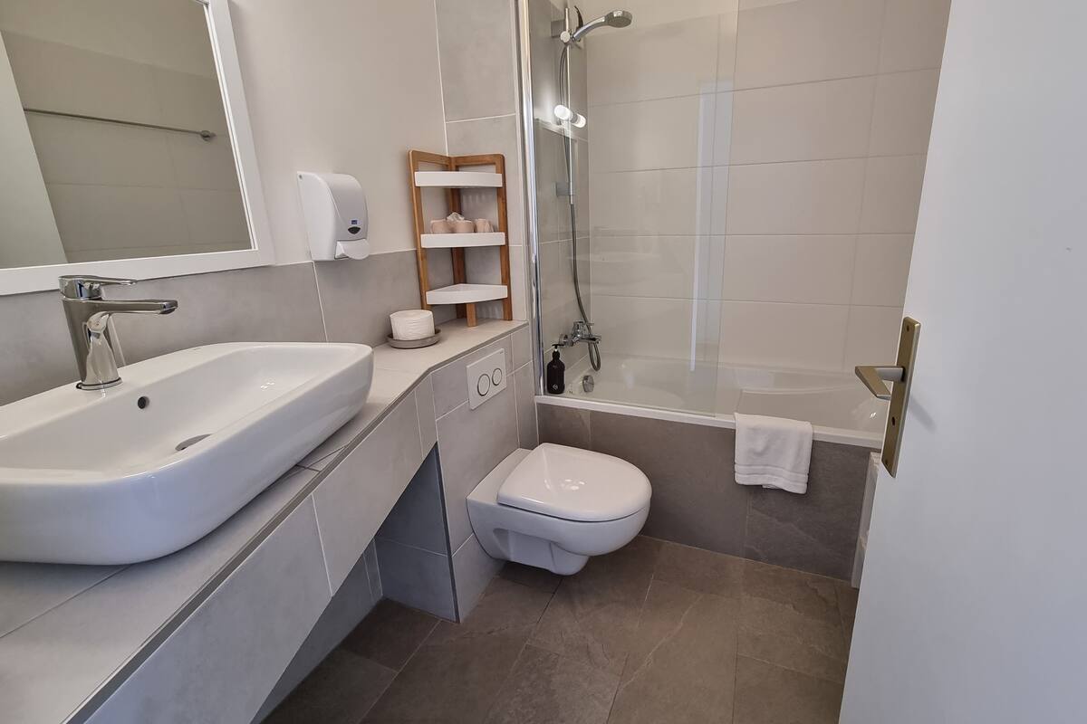 family room | bathroom | eco-friendly toiletries, hair dryer, towels, soap