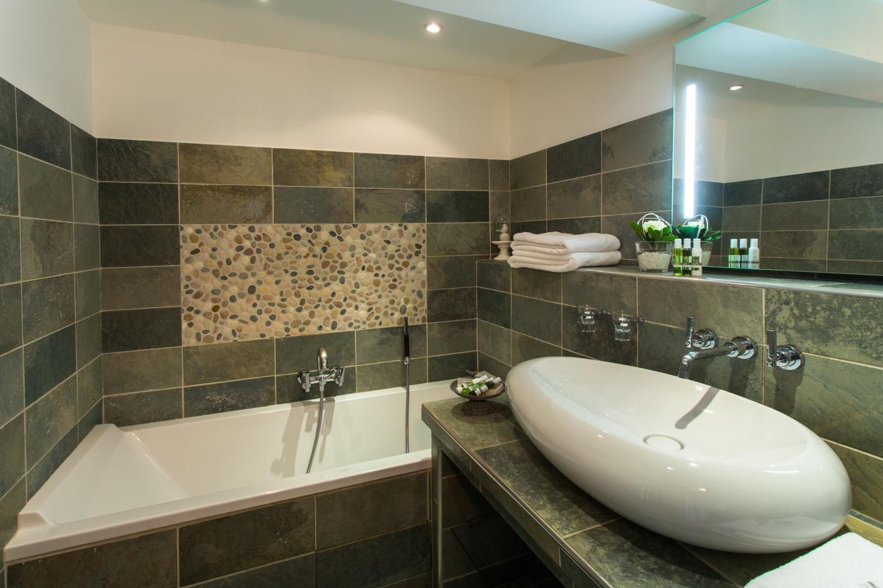 designer toiletries, hair dryer, bathrobes, slippers