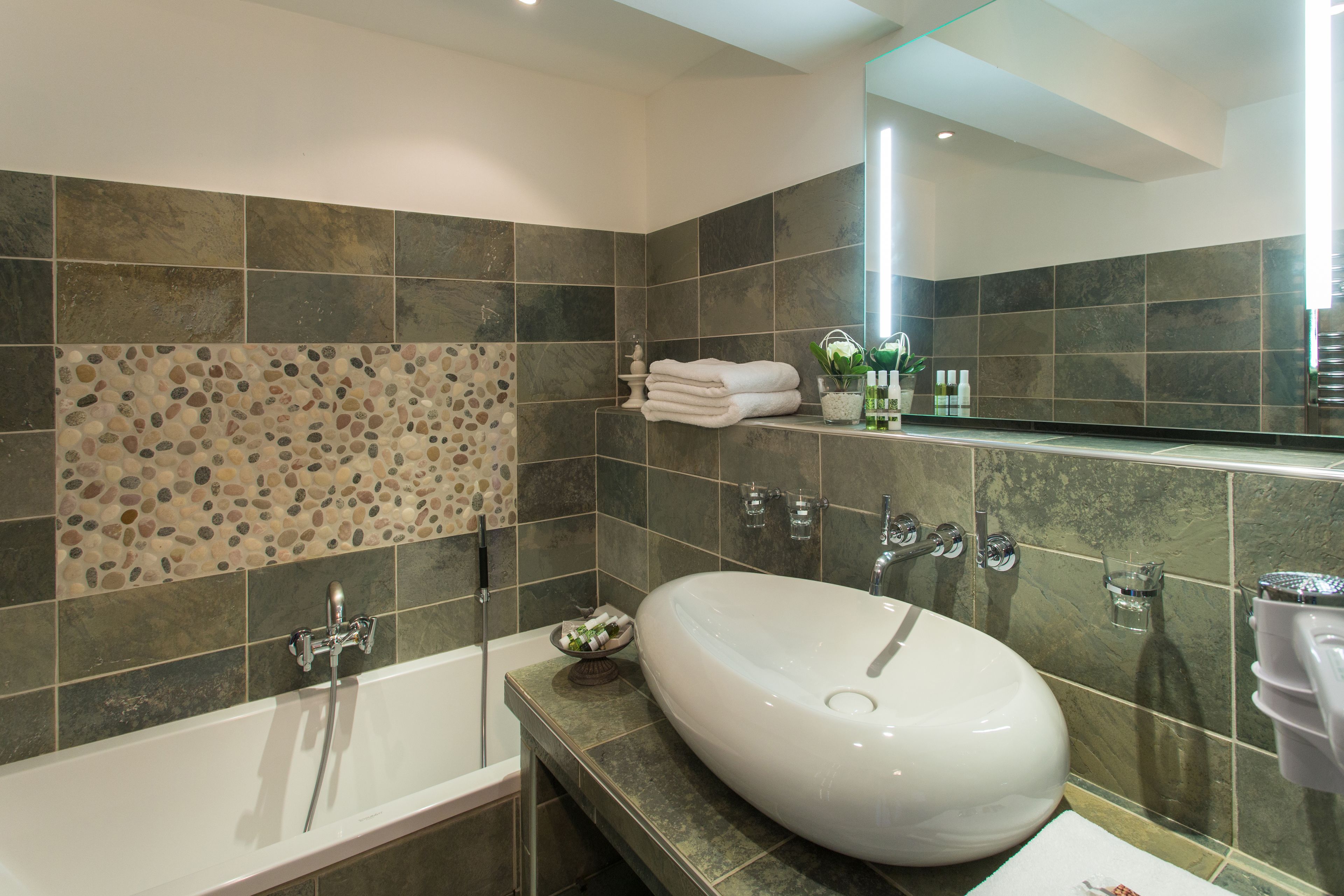 deluxe double room | bathroom | designer toiletries, hair dryer, bathrobes, slippers