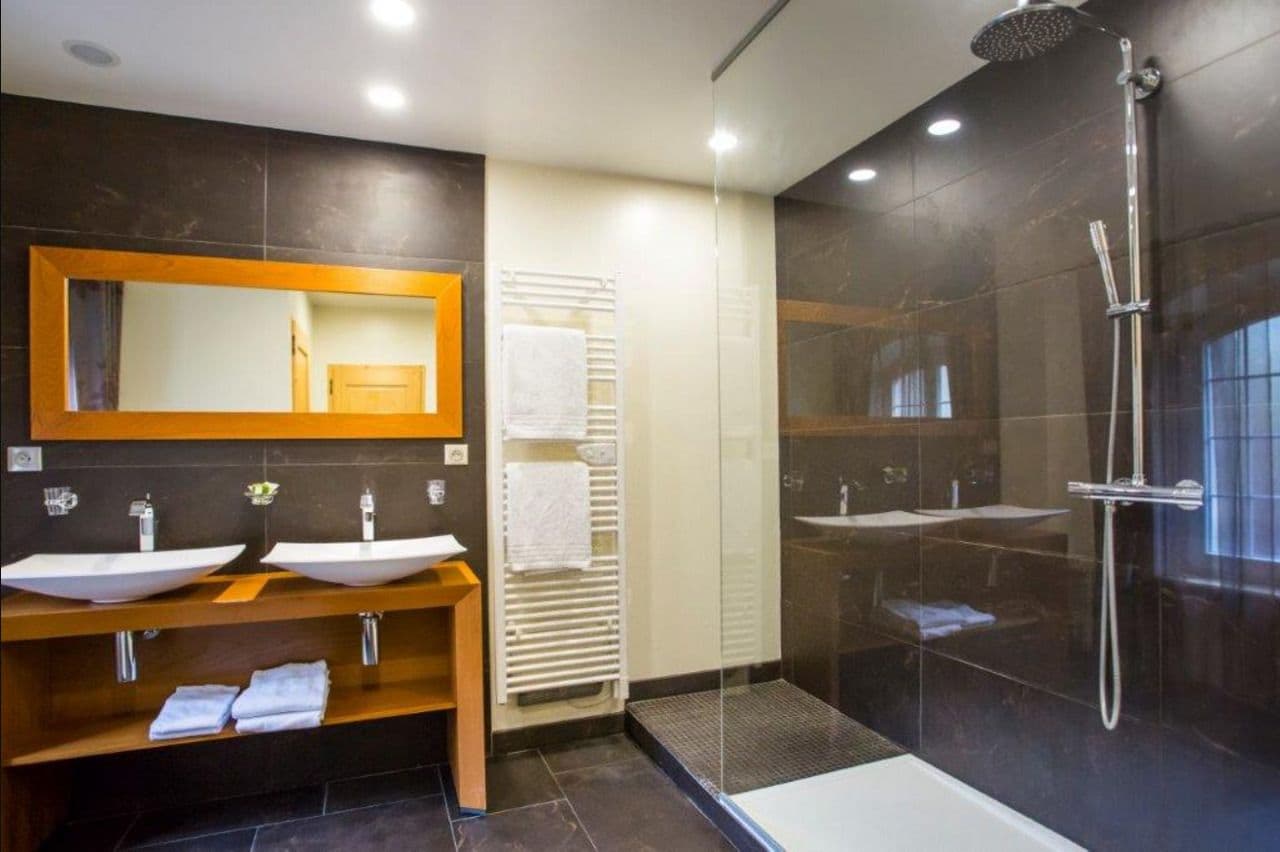 junior suite, jetted tub (privilege ) | bathroom | shower, bathrobes, towels