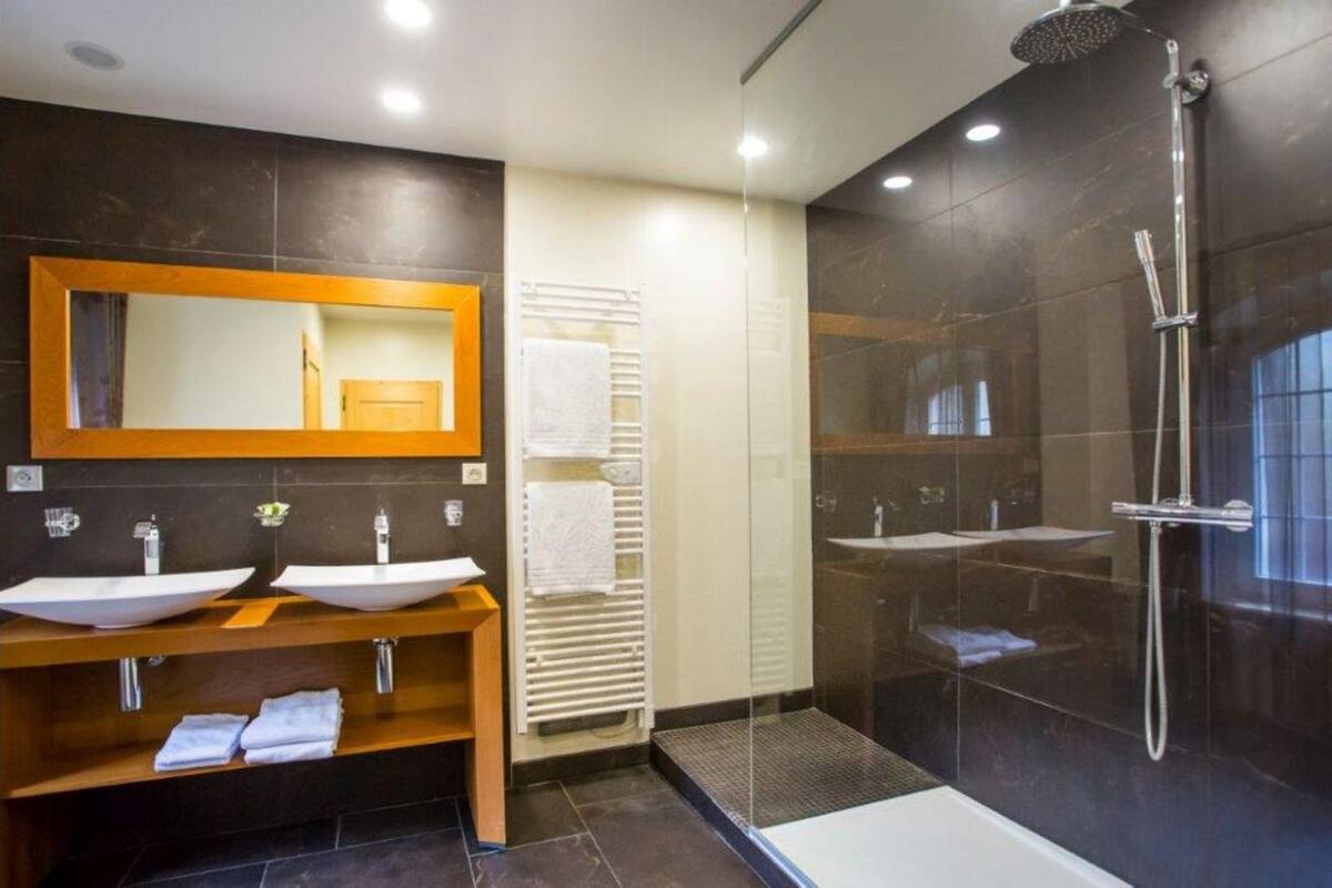junior suite, jetted tub (privilege ) | bathroom | shower, bathrobes, towels