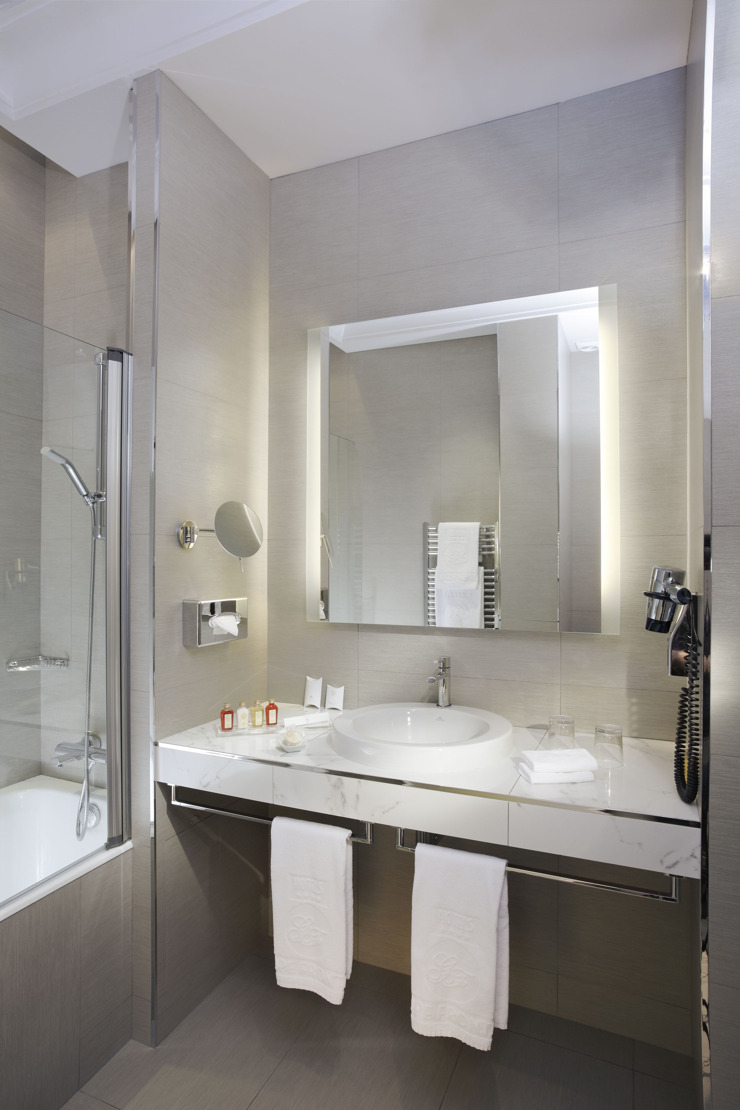 designer toiletries, hair dryer, bathrobes, slippers