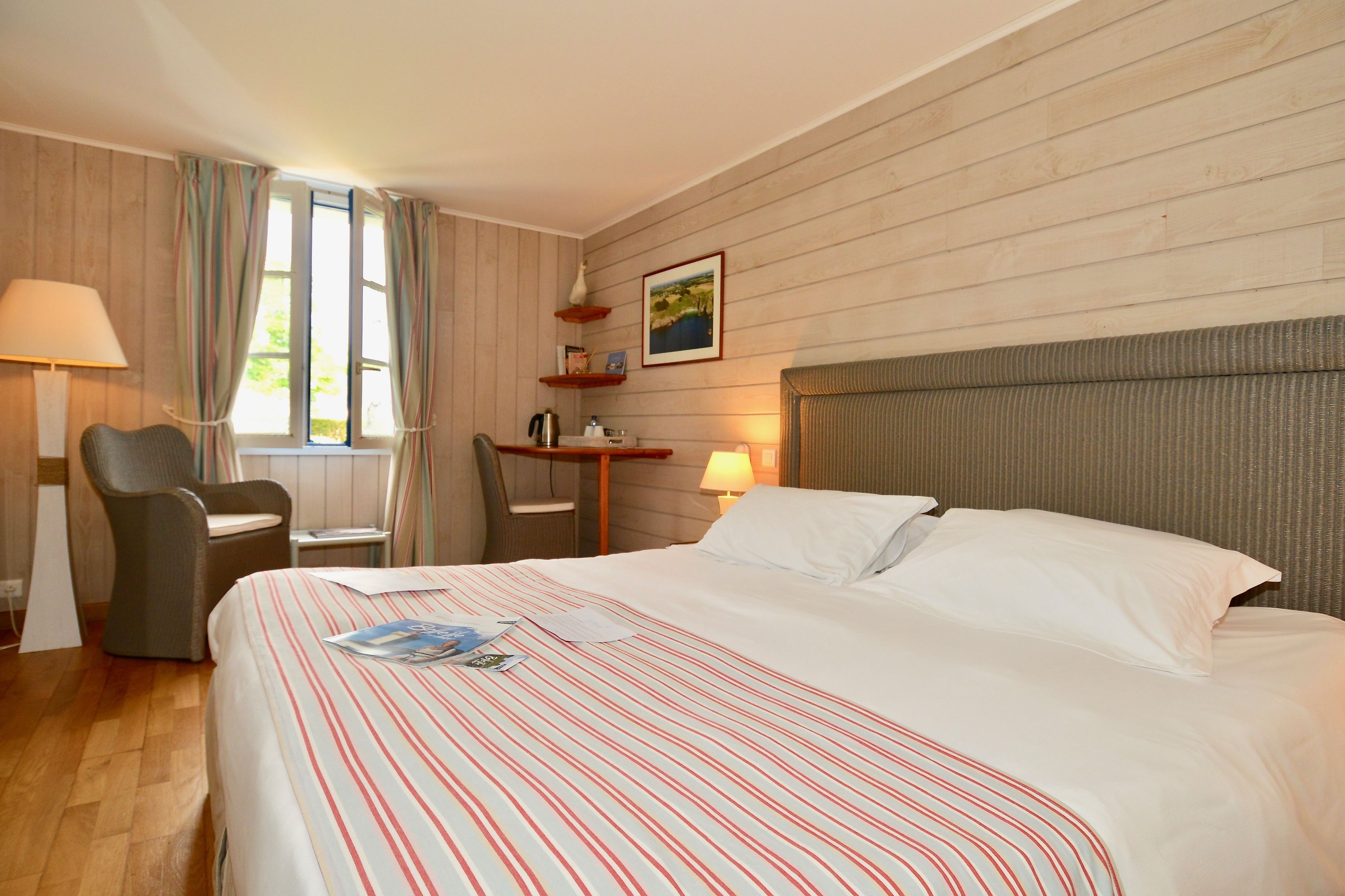 superior room, garden view, garden area | premium bedding, select comfort beds, in-room safe, desk