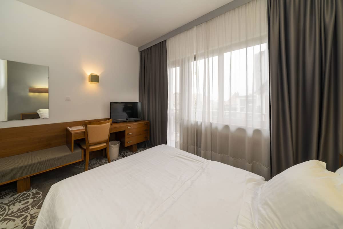 Standard Double Room Single Use, Balcony | Minibar, individually decorated, desk, laptop workspace