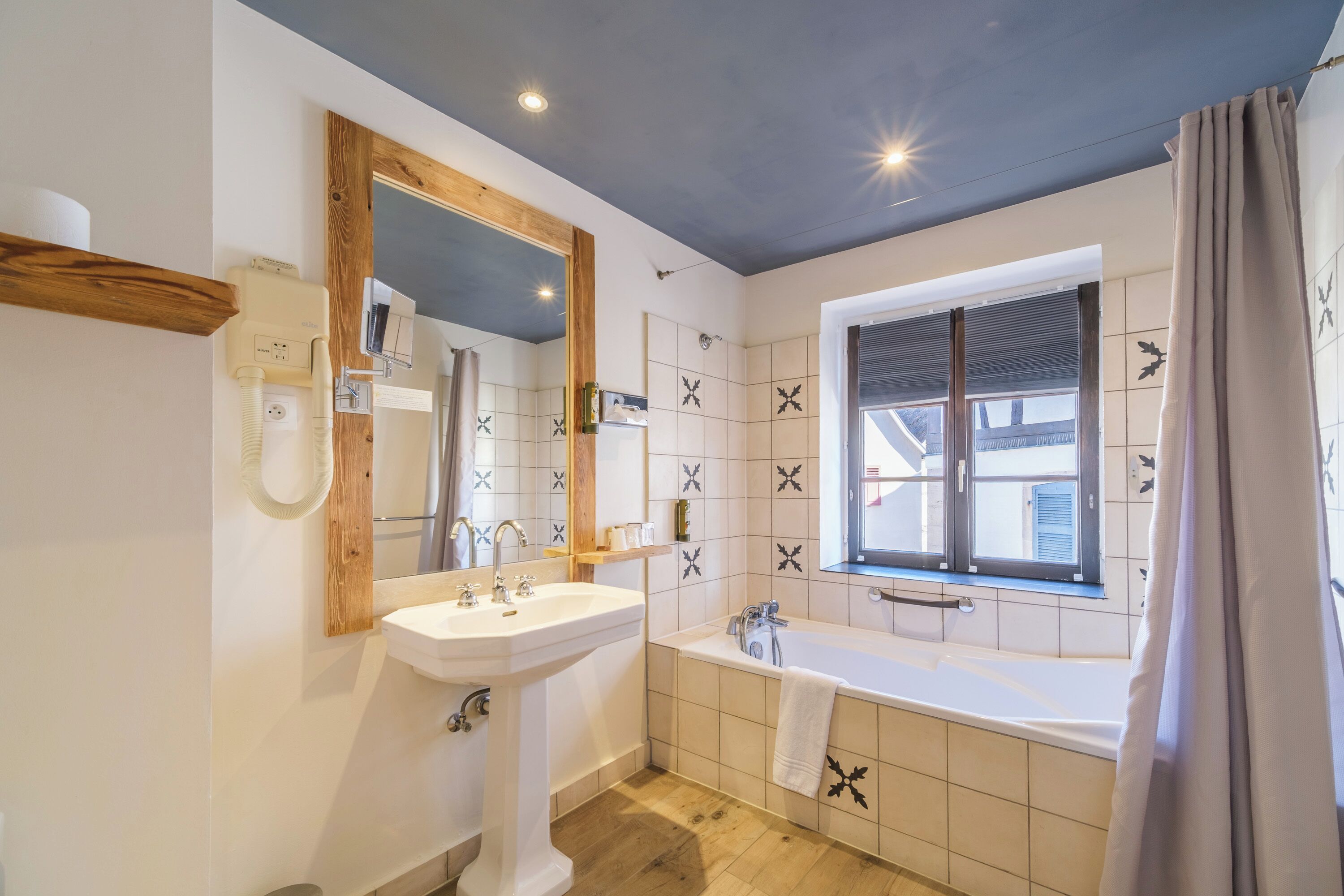 bathtub, free toiletries, hair dryer, towels