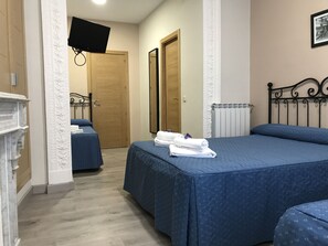 Quadruple Room, Private Bathroom | Premium bedding, in-room safe, desk, blackout curtains - Hostal El Pilar (Madrid)