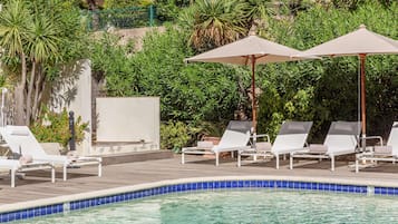 Seasonal outdoor pool, open 8 AM to 9:00 PM, pool umbrellas