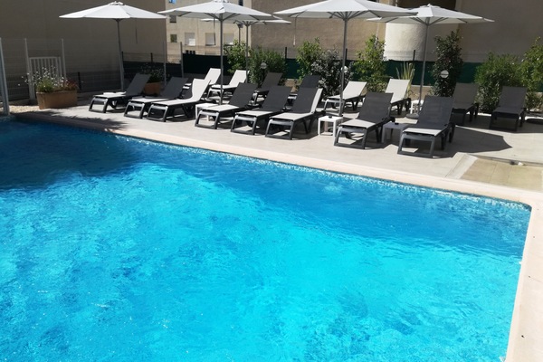 Seasonal outdoor pool, open 9:00 AM to 8:00 PM, pool umbrellas