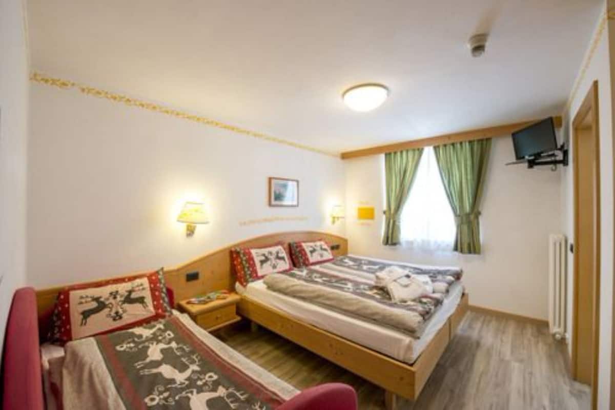 Triple Room | Premium bedding, down comforters, memory foam beds, in-room safe