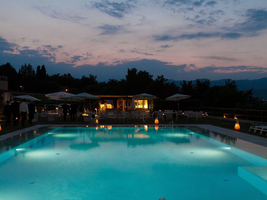 Seasonal outdoor pool, open 10:00 AM to 7:00 PM, pool umbrellas