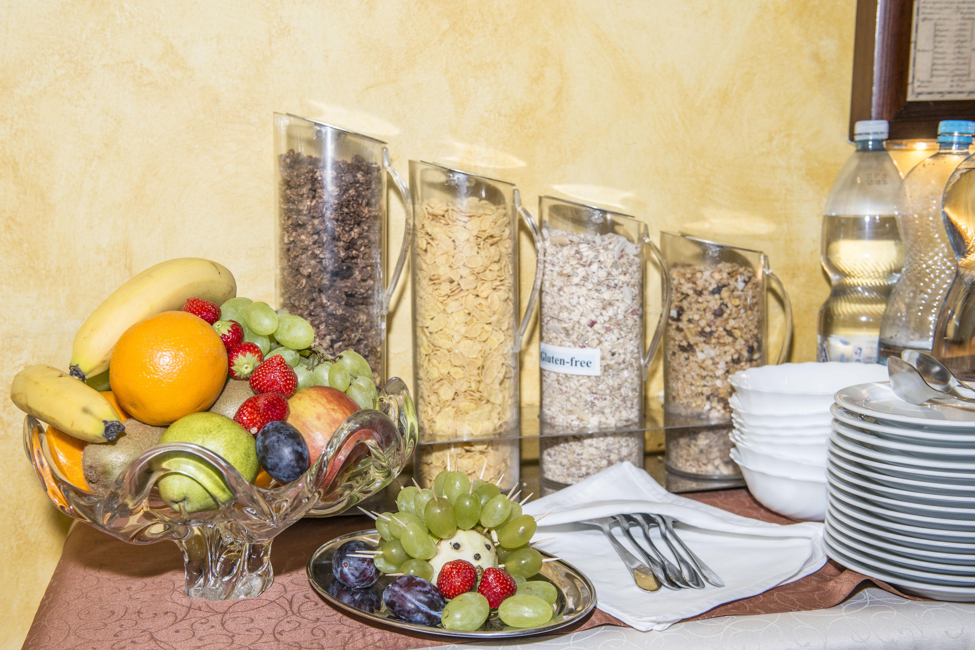 A buffet table with various food items and containers.