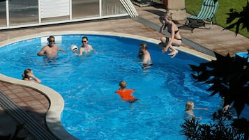 Seasonal outdoor pool, open 8:00 AM to 10:00 PM, pool umbrellas