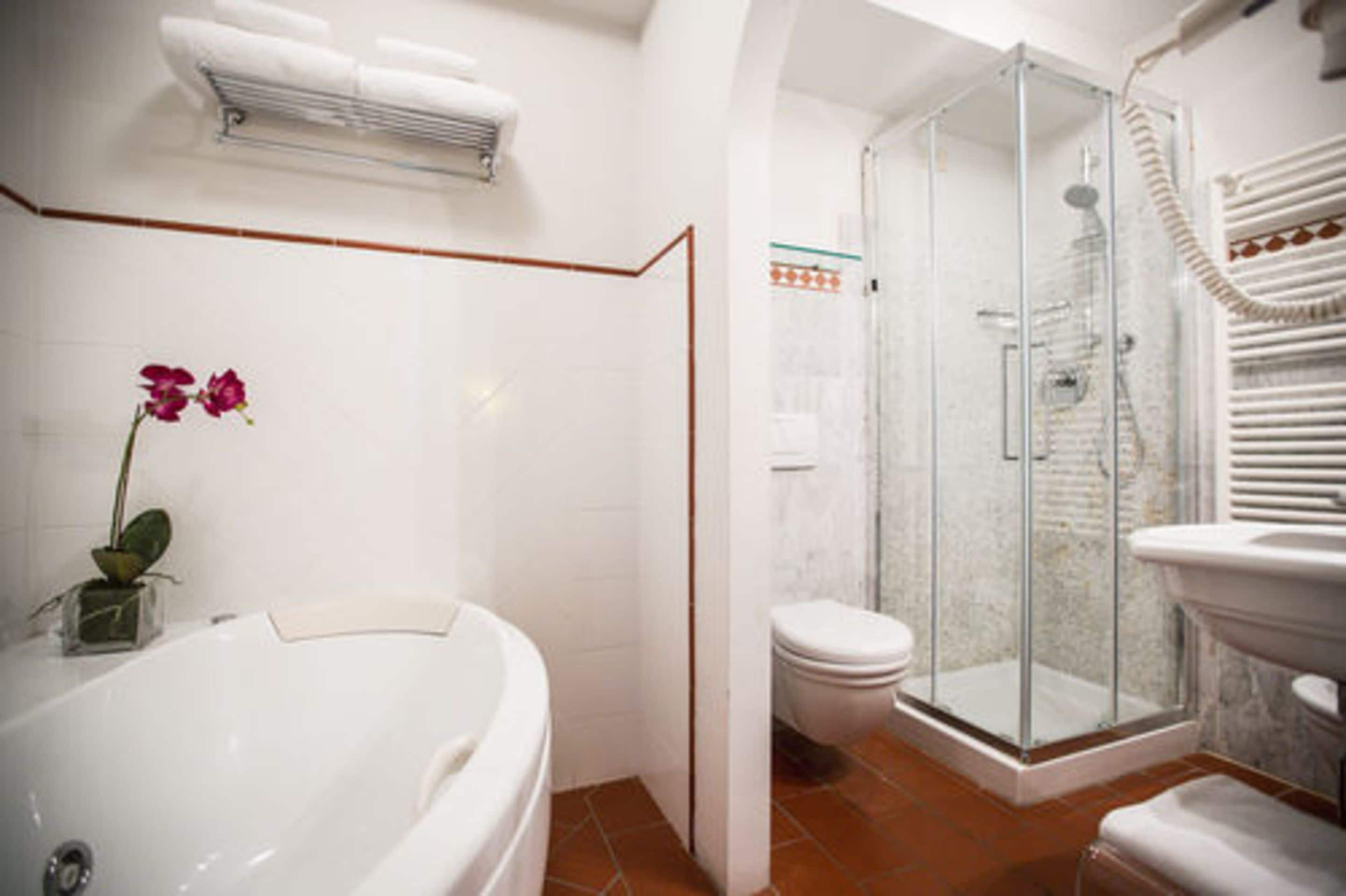 junior suite triple | bathroom | shower, free toiletries, hair dryer, slippers