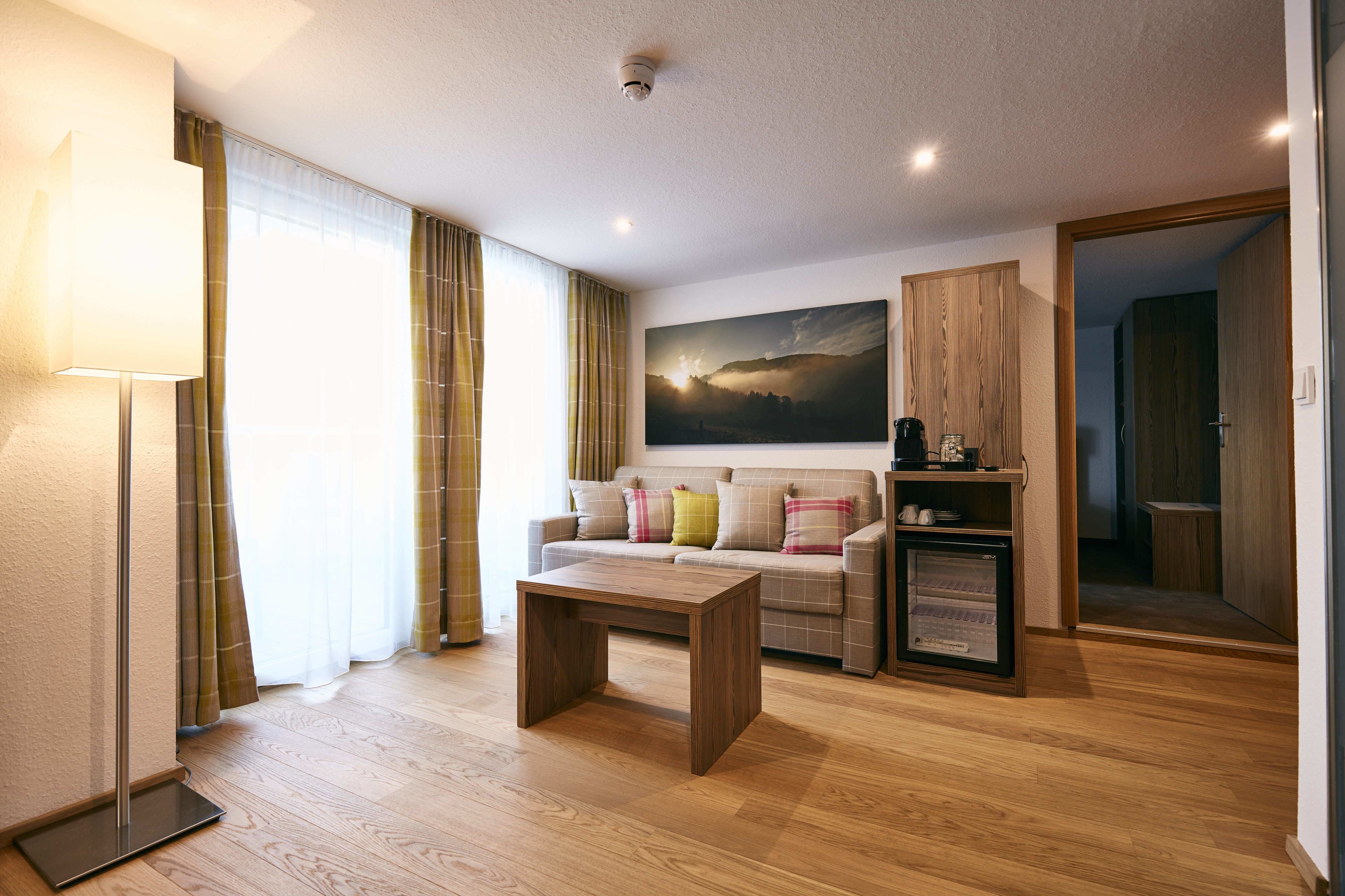 suite, 2 bedrooms, sauna, mountain view | living area | flat-screen tv