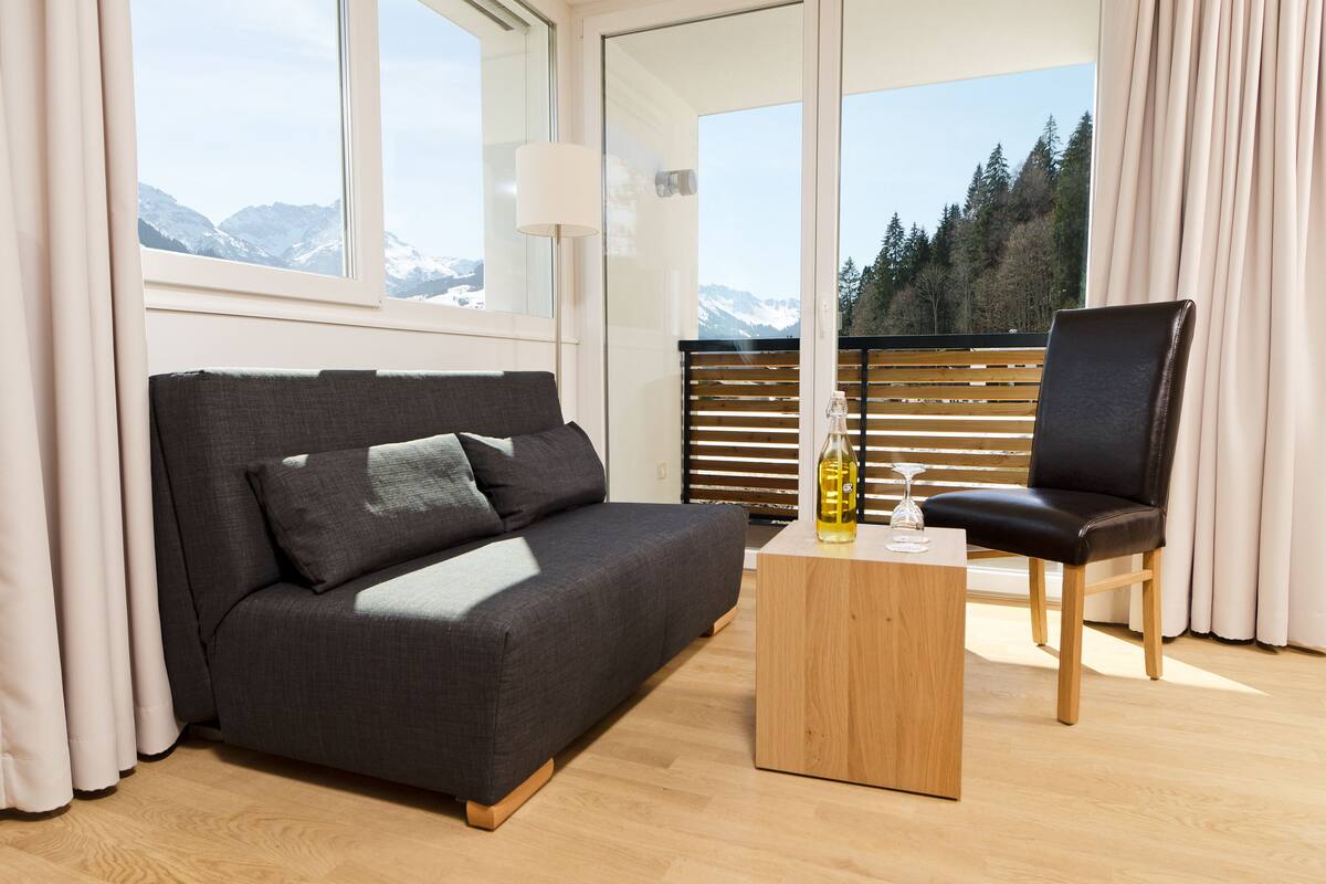 comfort double room, balcony or terrace (sonnahölderle) | living area | flat-screen tv