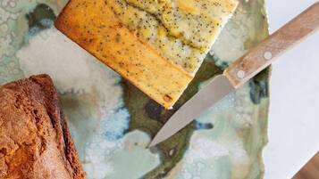 A cake on a plate with a knife.