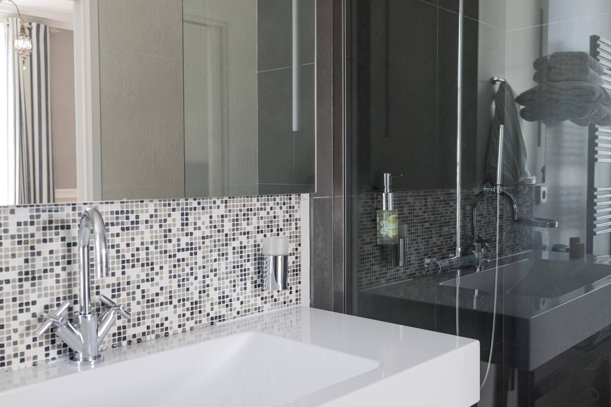 superior room | bathroom | shower, hair dryer, towels