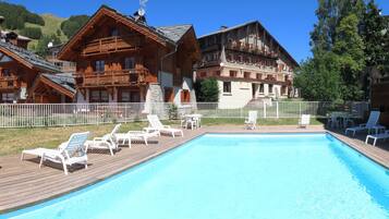 Seasonal outdoor pool, pool loungers