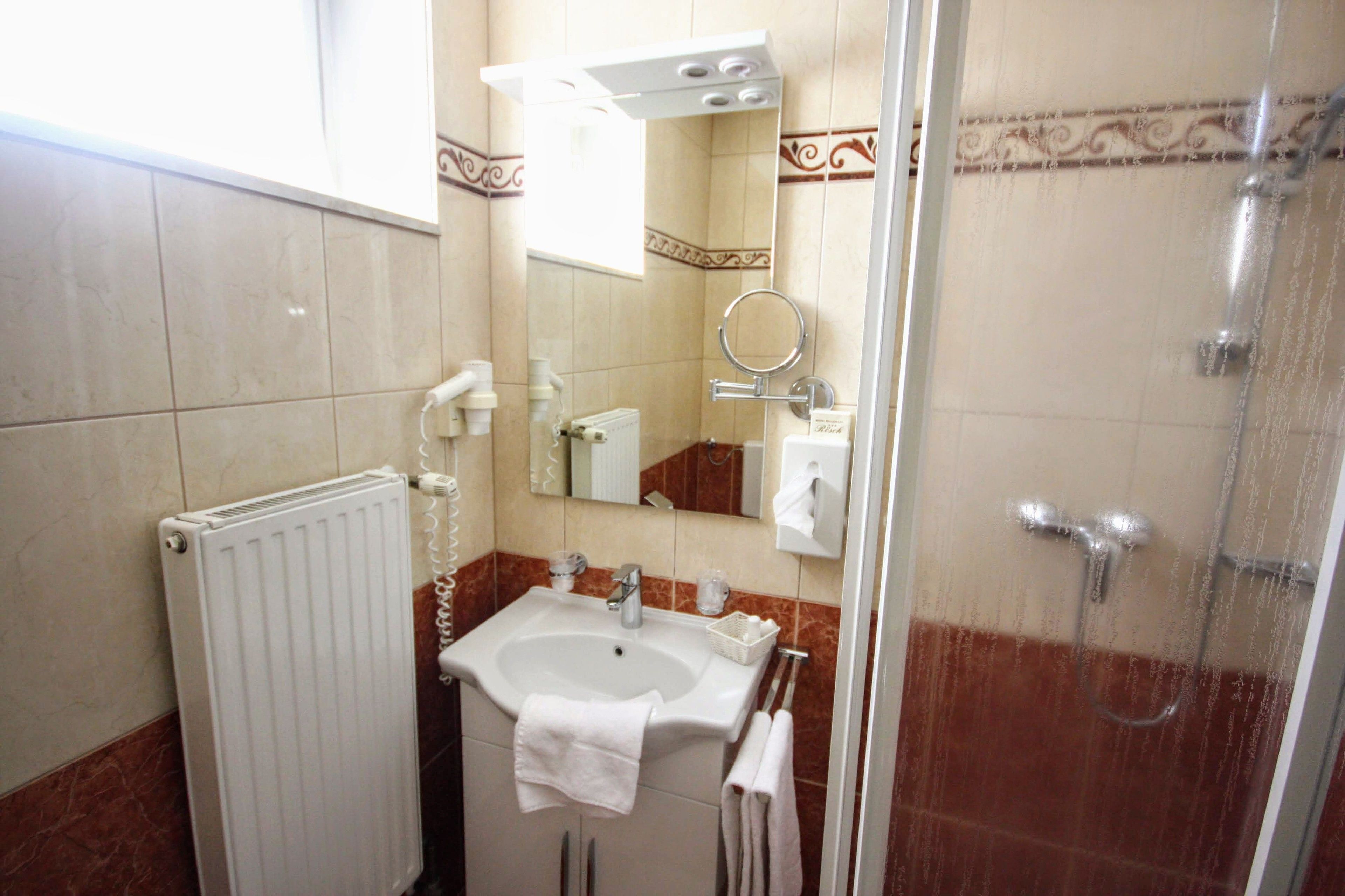 shower, hair dryer, bathrobes, towels