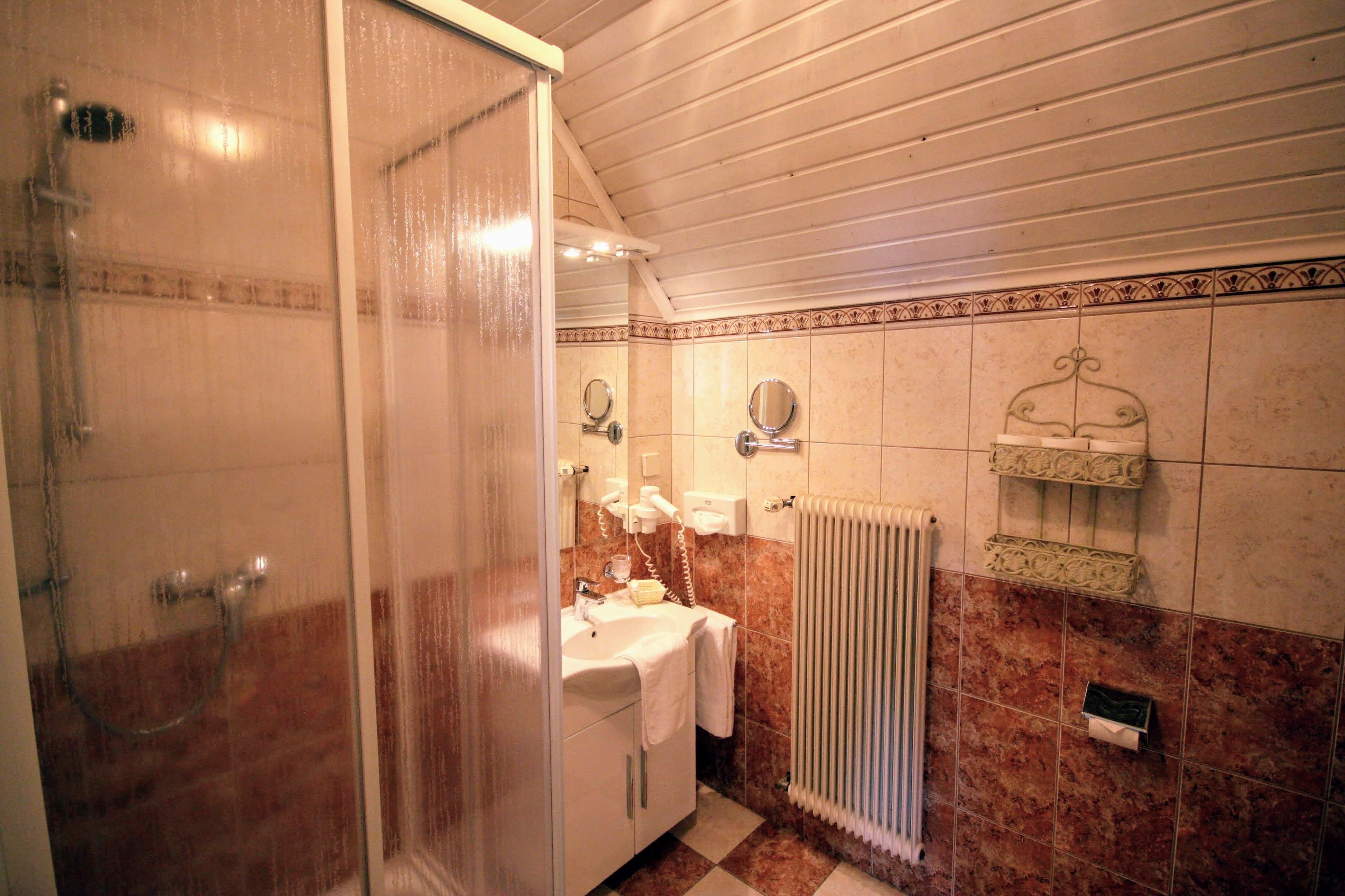 superior double room | bathroom | shower, hair dryer, bathrobes, towels