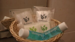 A wicker basket containing BioEnergy products, including two tubes and two packets. - Hotel Salerno (Milan)