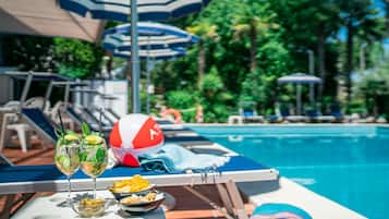 Seasonal outdoor pool, pool umbrellas, pool loungers