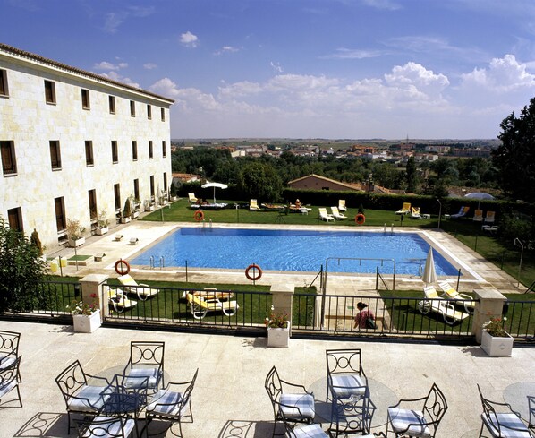 Outdoor pool, open 11:30 AM to 8:30 PM, pool umbrellas, pool loungers