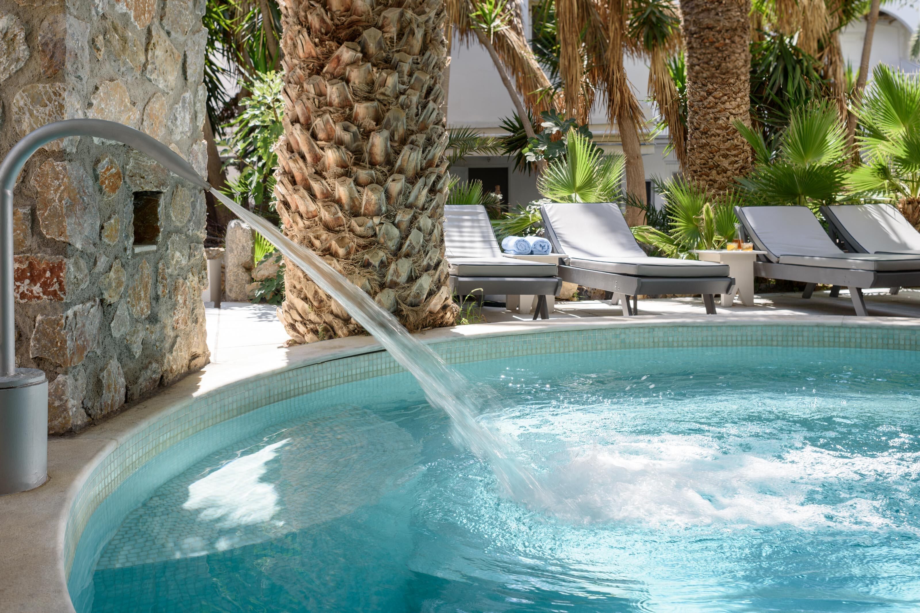 Indoor pool, seasonal outdoor pool, pool umbrellas, pool loungers