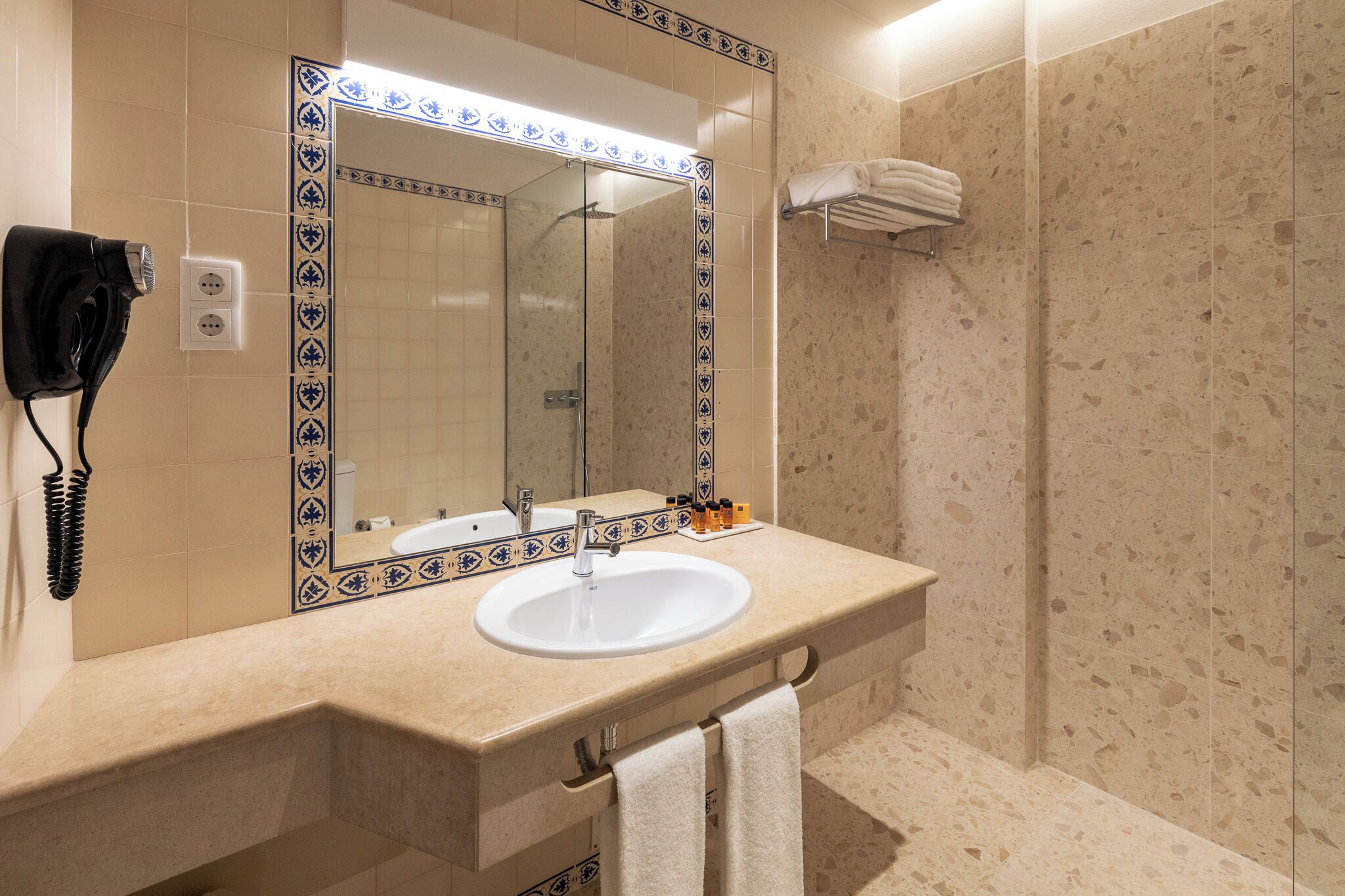 shower, hair dryer, bidet, towels