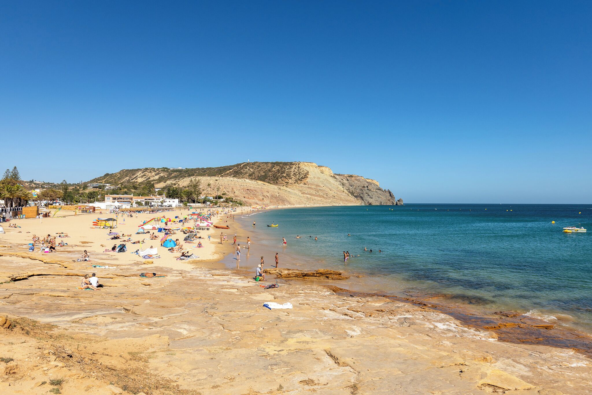 beach nearby, white sand, beach towels