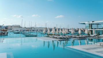 Outdoor pool, open 10:00 AM to 6:00 PM, pool umbrellas, sun loungers