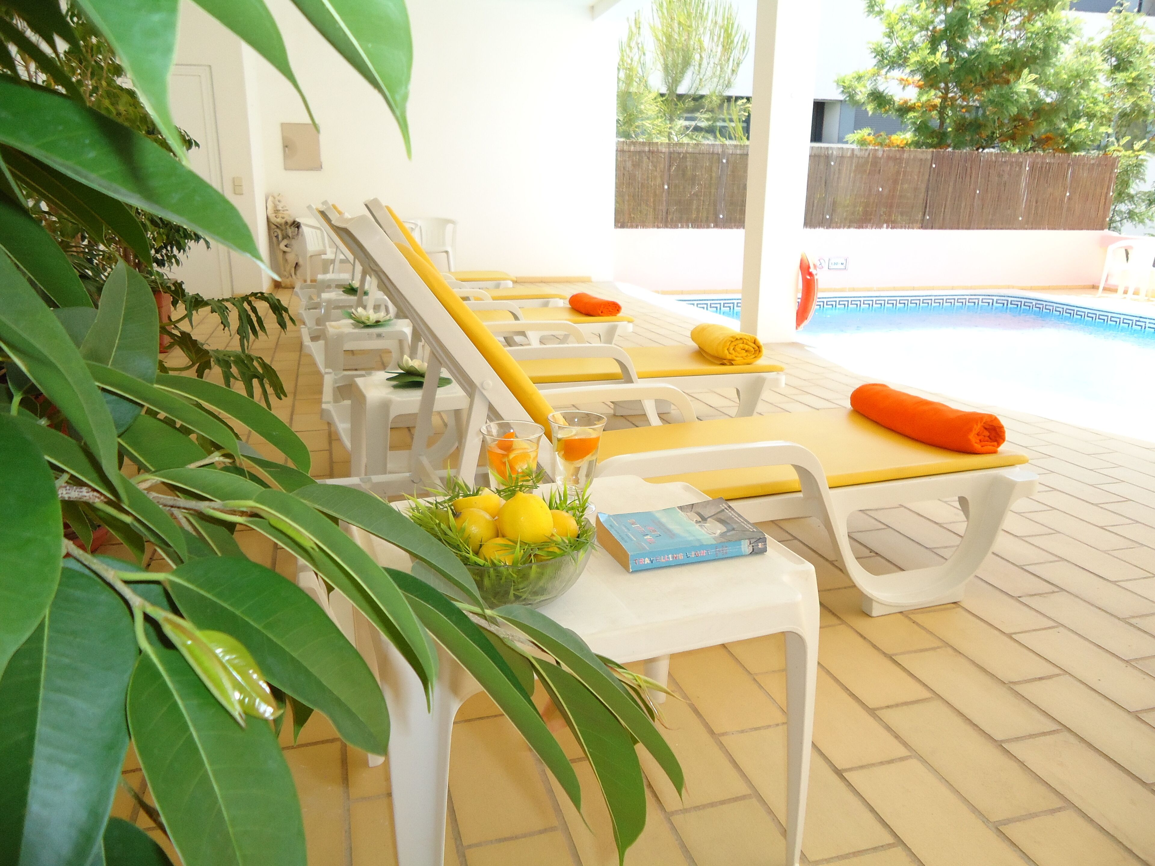 seasonal outdoor pool, pool loungers