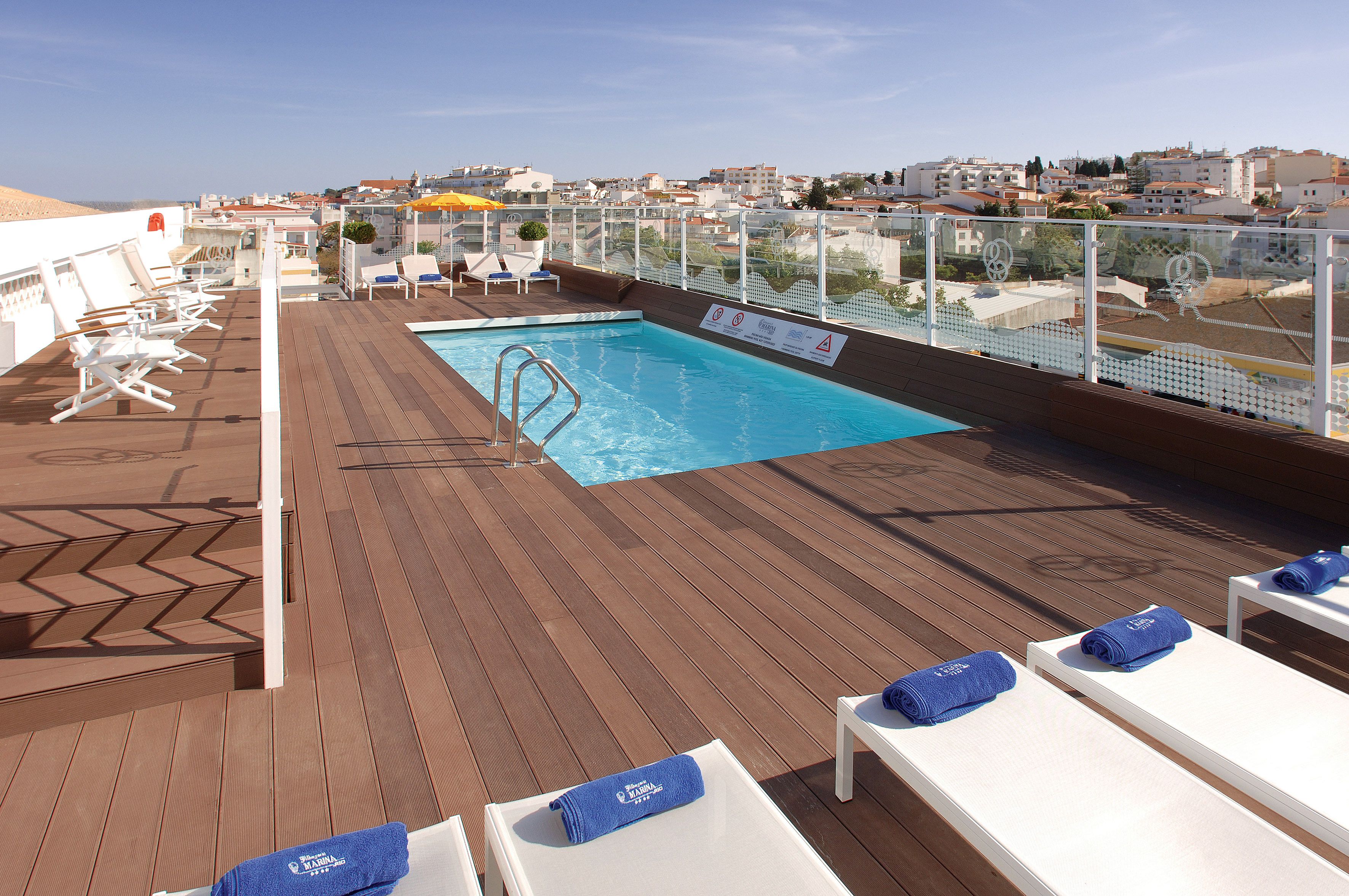 outdoor pool, open 8:00 am to 8:00 pm, pool umbrellas, pool loungers