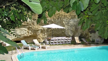 Seasonal outdoor pool, open 10 AM to 7:30 PM, pool umbrellas