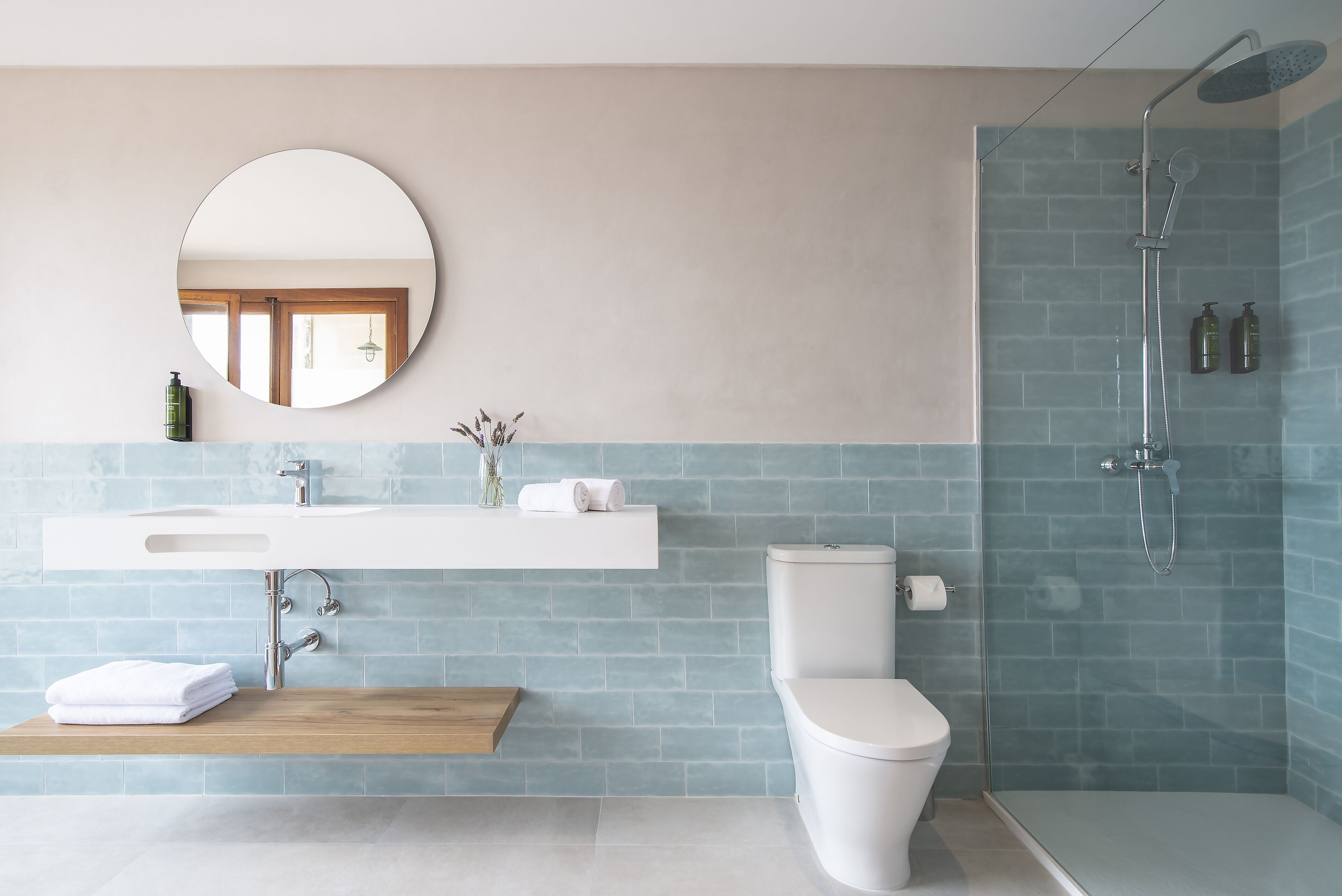 shower, rainfall showerhead, hair dryer, towels