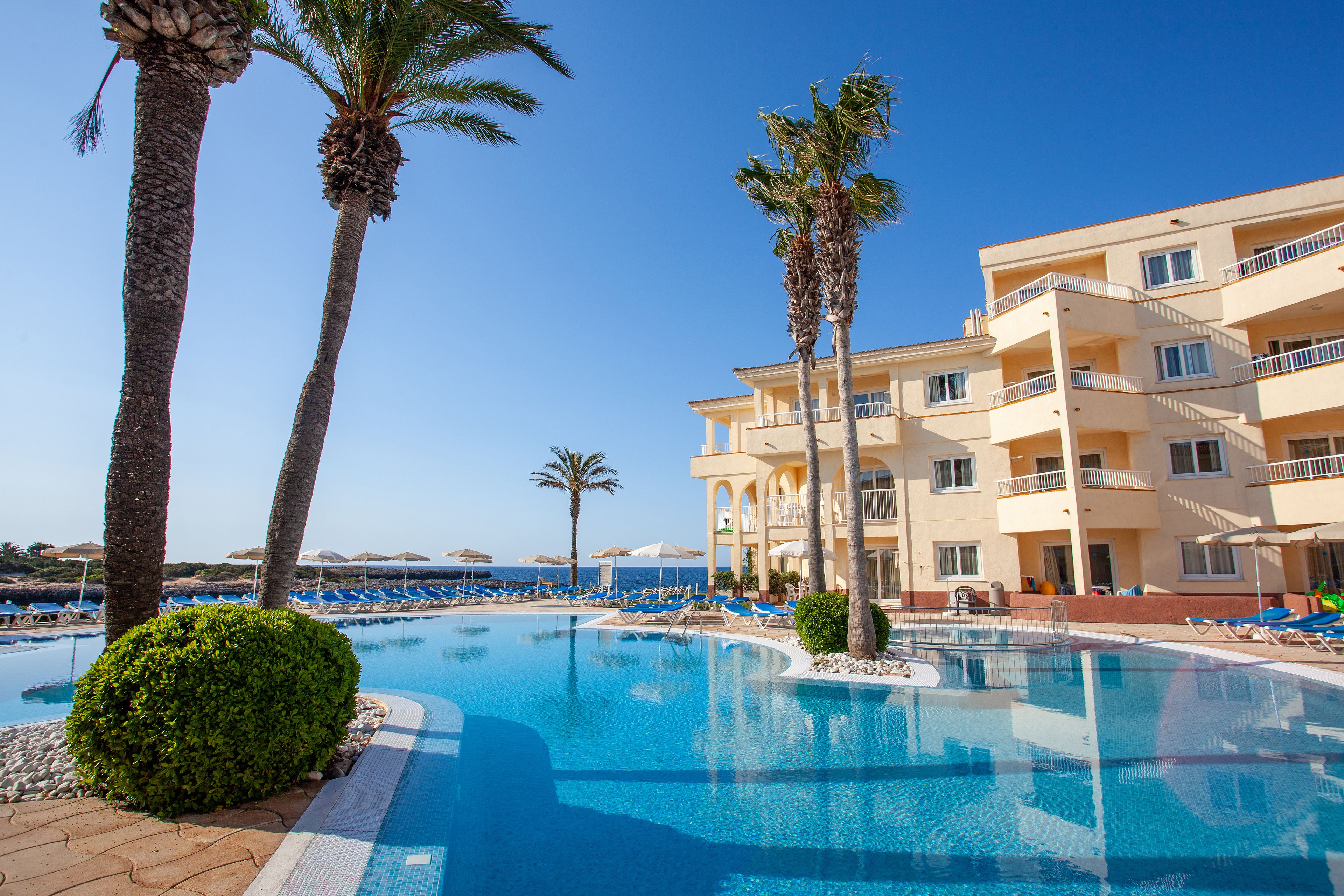 outdoor pool, pool umbrellas, pool loungers