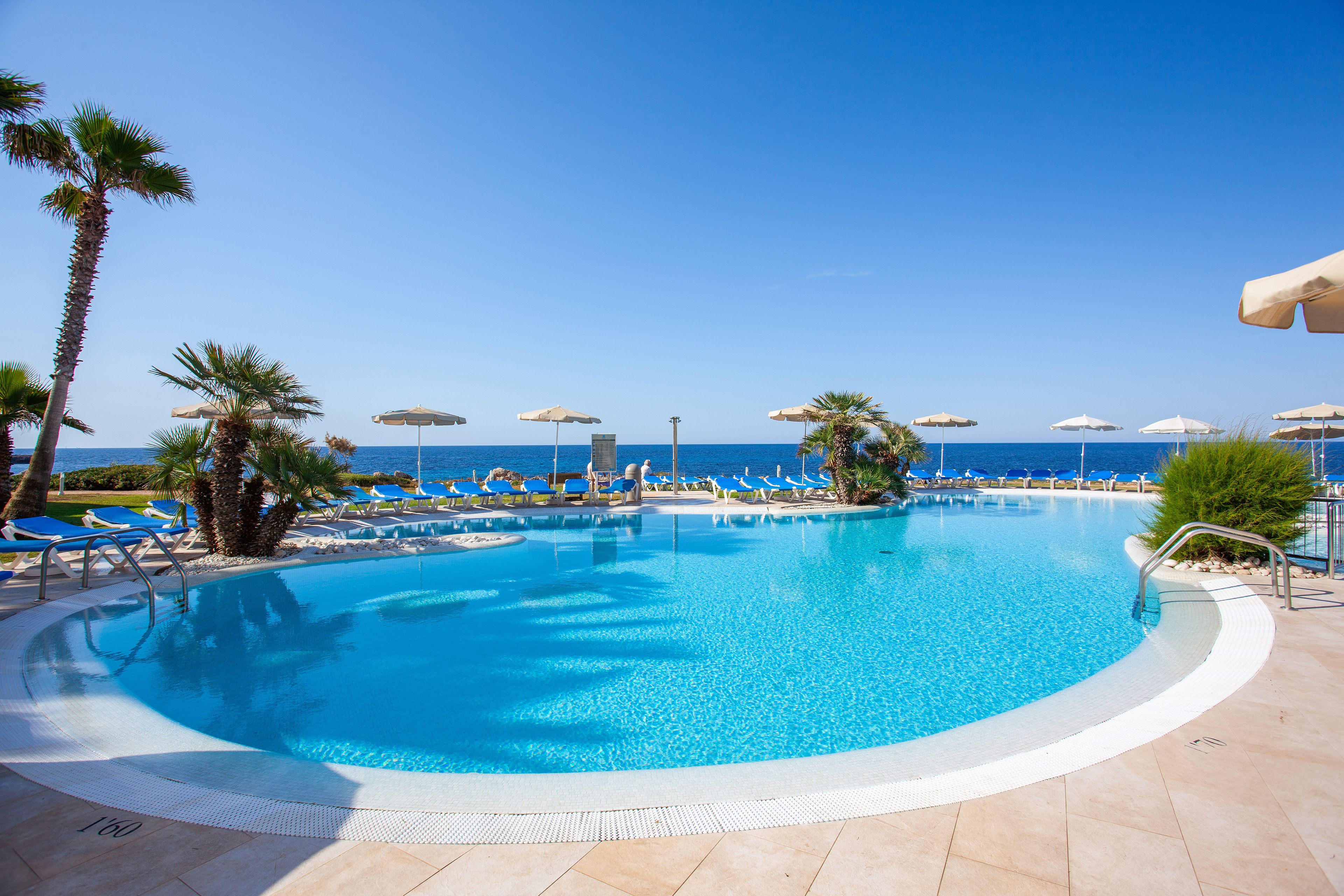 outdoor pool, pool umbrellas, pool loungers