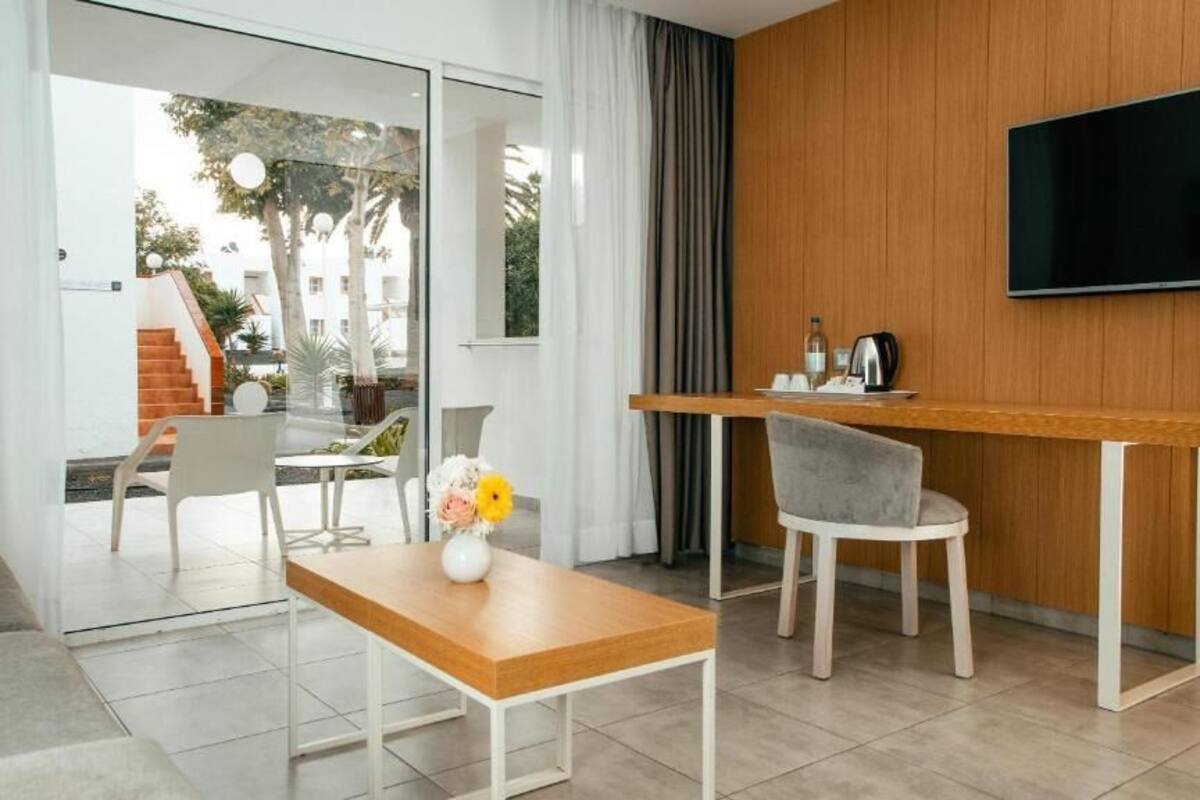 suite, 2 bedrooms | living area | tv