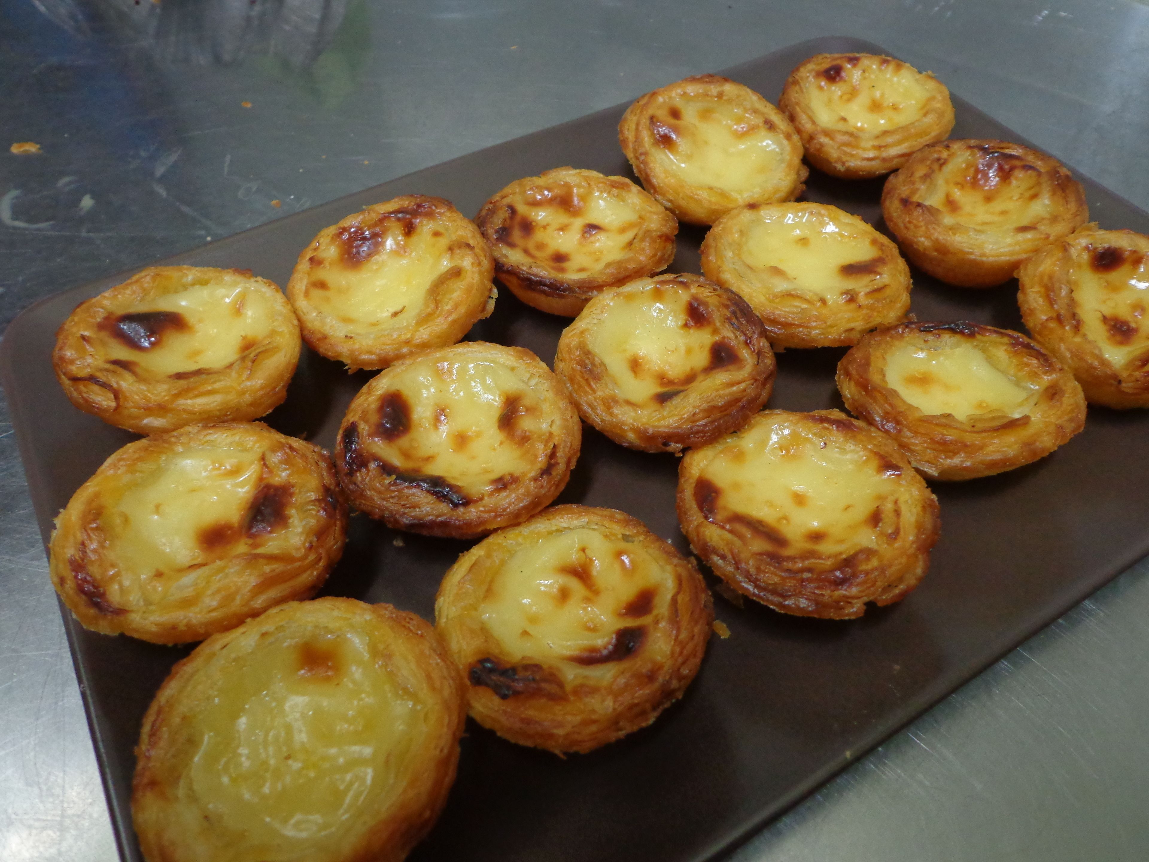 A tray of freshly baked egg tarts.