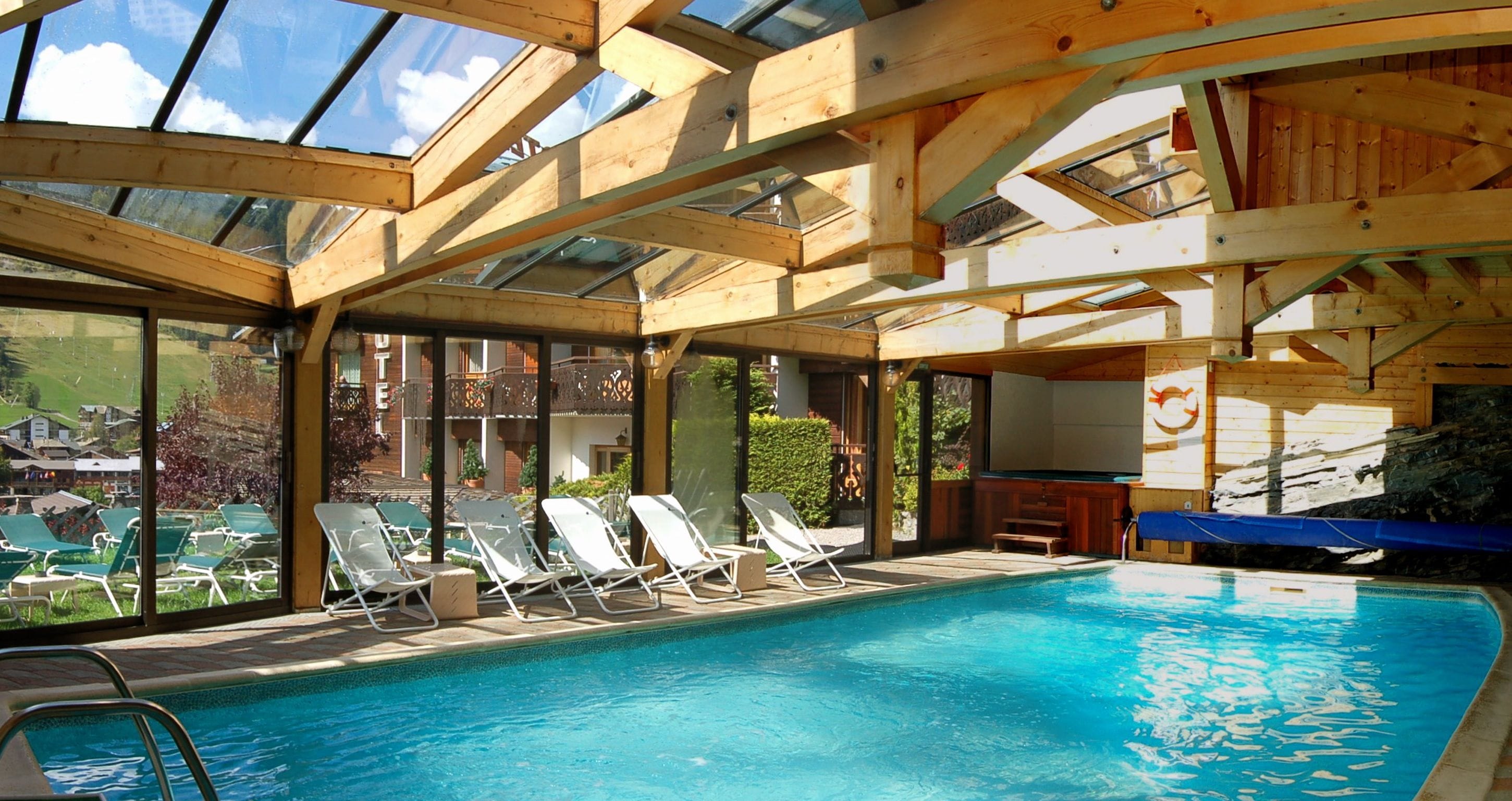 indoor pool, open 9:00 am to 9:00 pm, pool umbrellas, pool loungers
