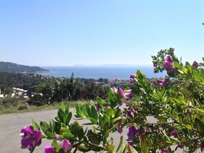 Enjoy breathtaking views of the sea and distant hills from this scenic coastal location.