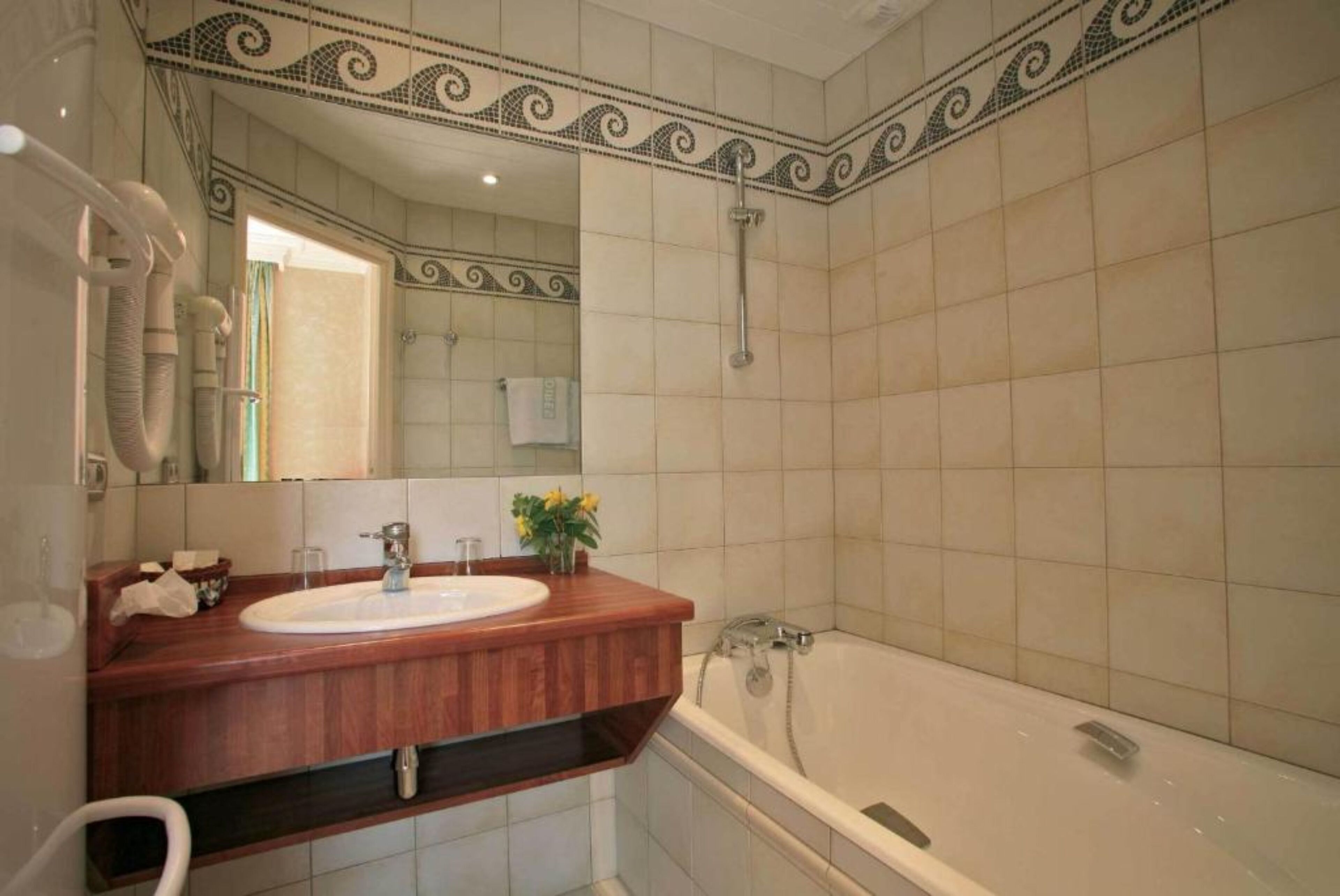 bathtub, hair dryer, towels