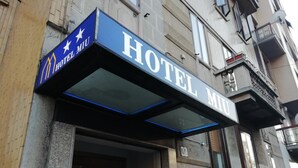 A hotel entrance with a sign reading "HOTEL MIU" and a star logo. - Miu Hotel (Milan)